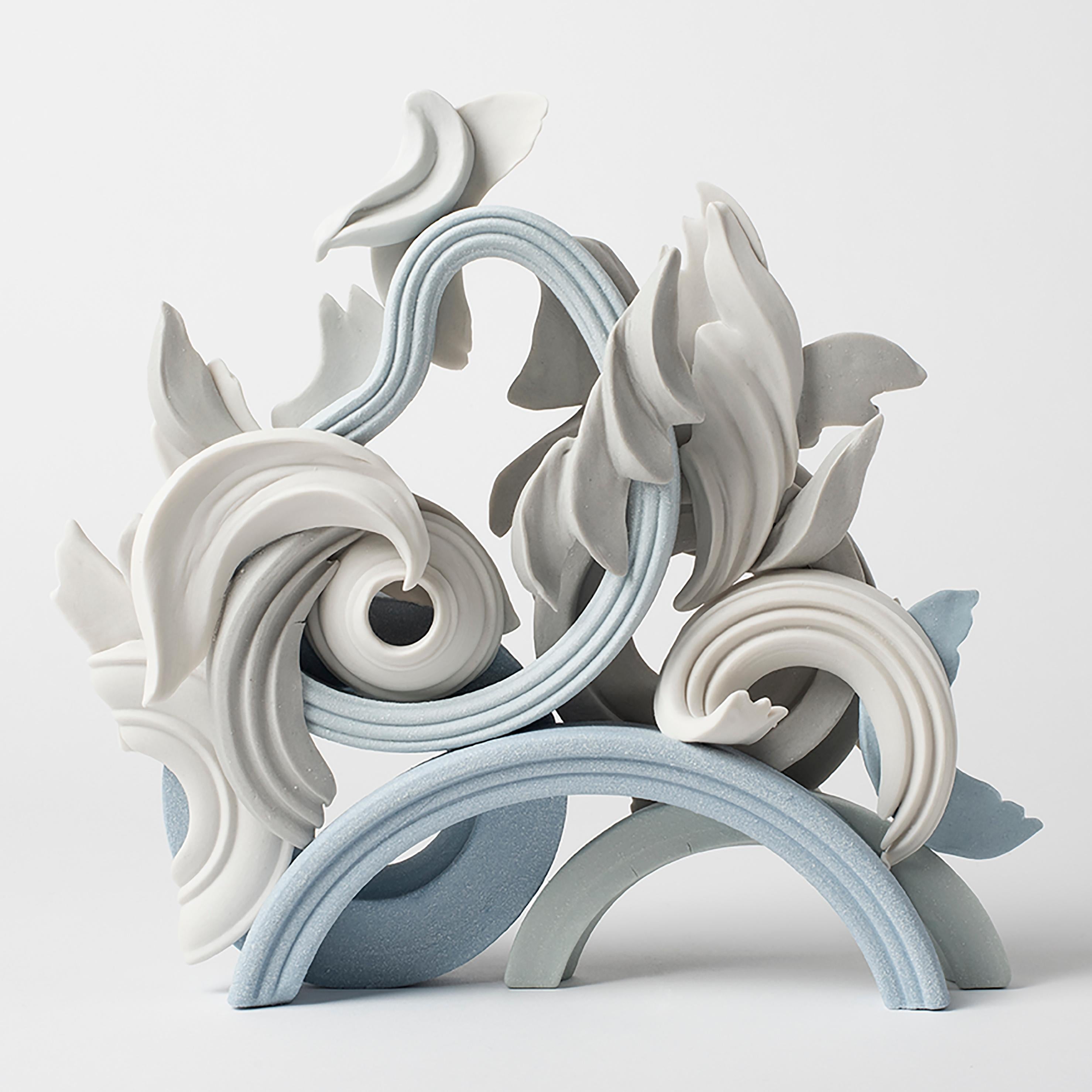 Incidental V is a unique handmade coloured porcelain ceramic sculpture by the British artist Jo Taylor. A completely hand-built artwork created from architectural-inspired flourishes and swirls.

For Taylor, the making process hugely influences the