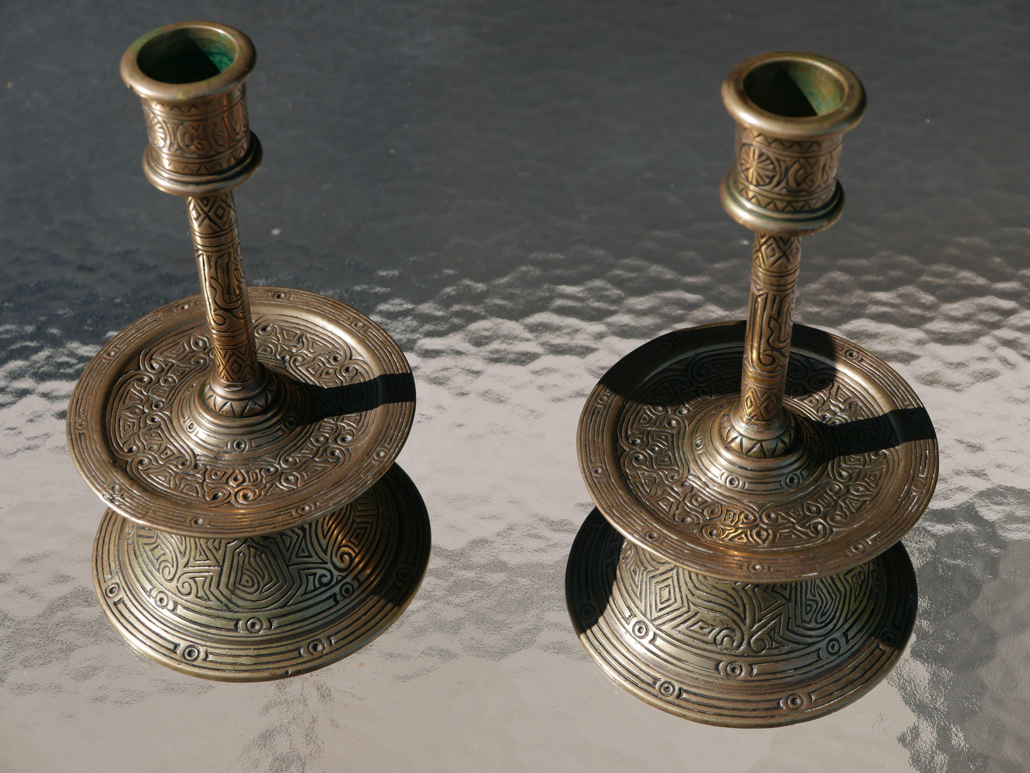 Beautiful and rare museum quality pair of incised of 17th Century Ottoman bronze candlesticks. They are virtually identical to the one pictured on page 56, figure 61, in the book “Old Domestic Base-Metal Candlesticks, from the 13th to 19th Century”