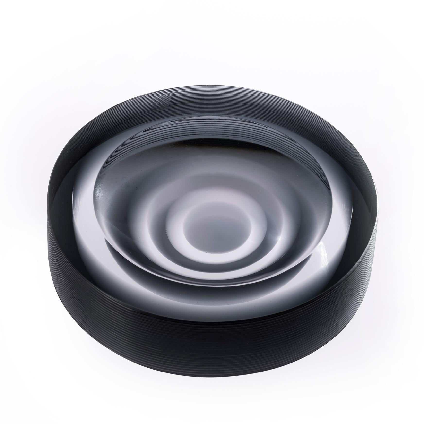 Incisioni Iridi stripe ashtray by Purho
Dimensions: D14x H3.5 cm
Materials: Glass
Other colours and dimensions are available. 

Purho is a new protagonist of made in Italy design, a work of synthesis, a research that has lasted for years, an