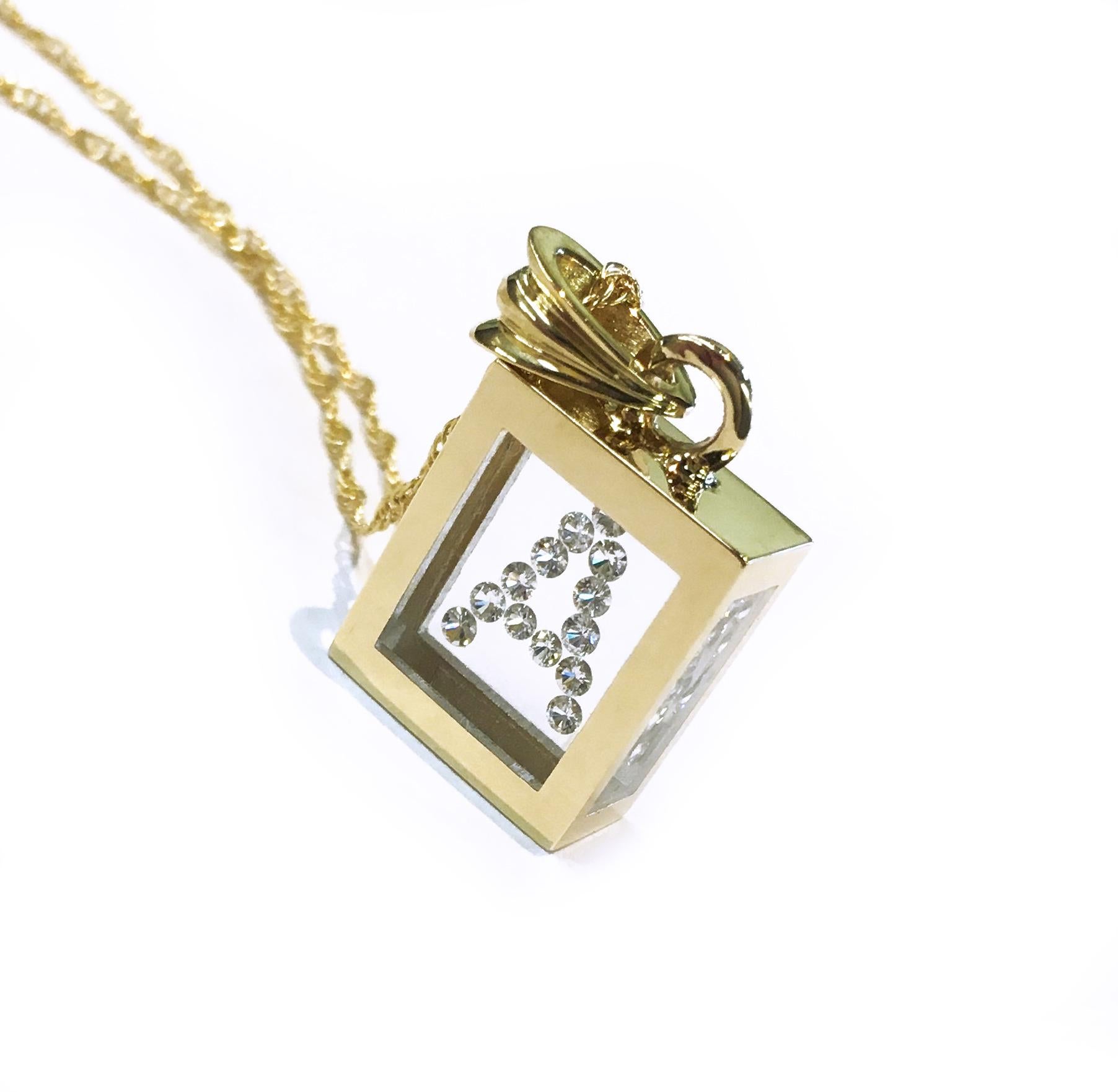 Incogem Floating Diamond Pendant: 14k Yellow Gold, available in letters A-Z. The pendants are handcrafted of recycled 14k yellow gold. The diamonds are brilliant cut, 58 facets, VS1 in clarity (G.I.A.) and H in color (G.I.A.). Each diamond weighs