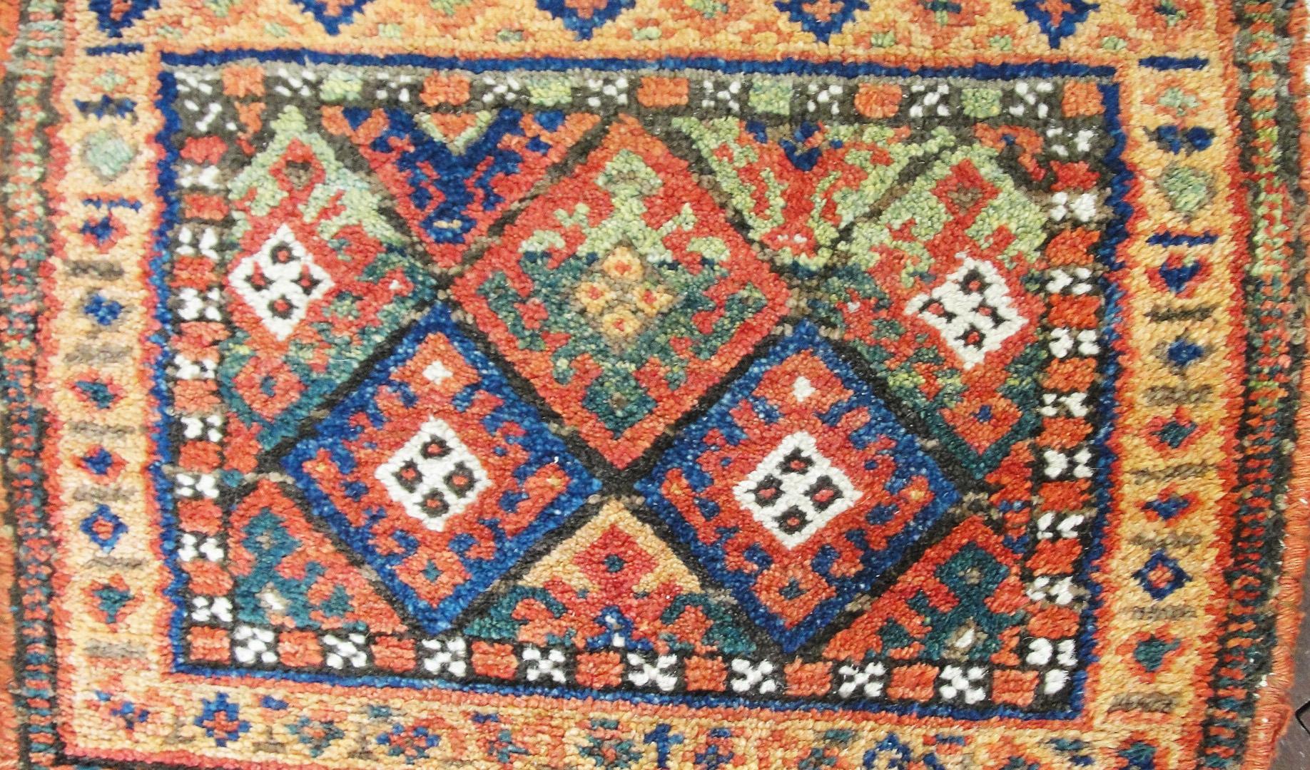 This is an authentic handmade rug. It was made in Kurdish town circa 1910s or before. The materials are wool pile with cotton foundation. The colors are from vegetable dyes, and the general pattern is geometric design inside two borders.
The