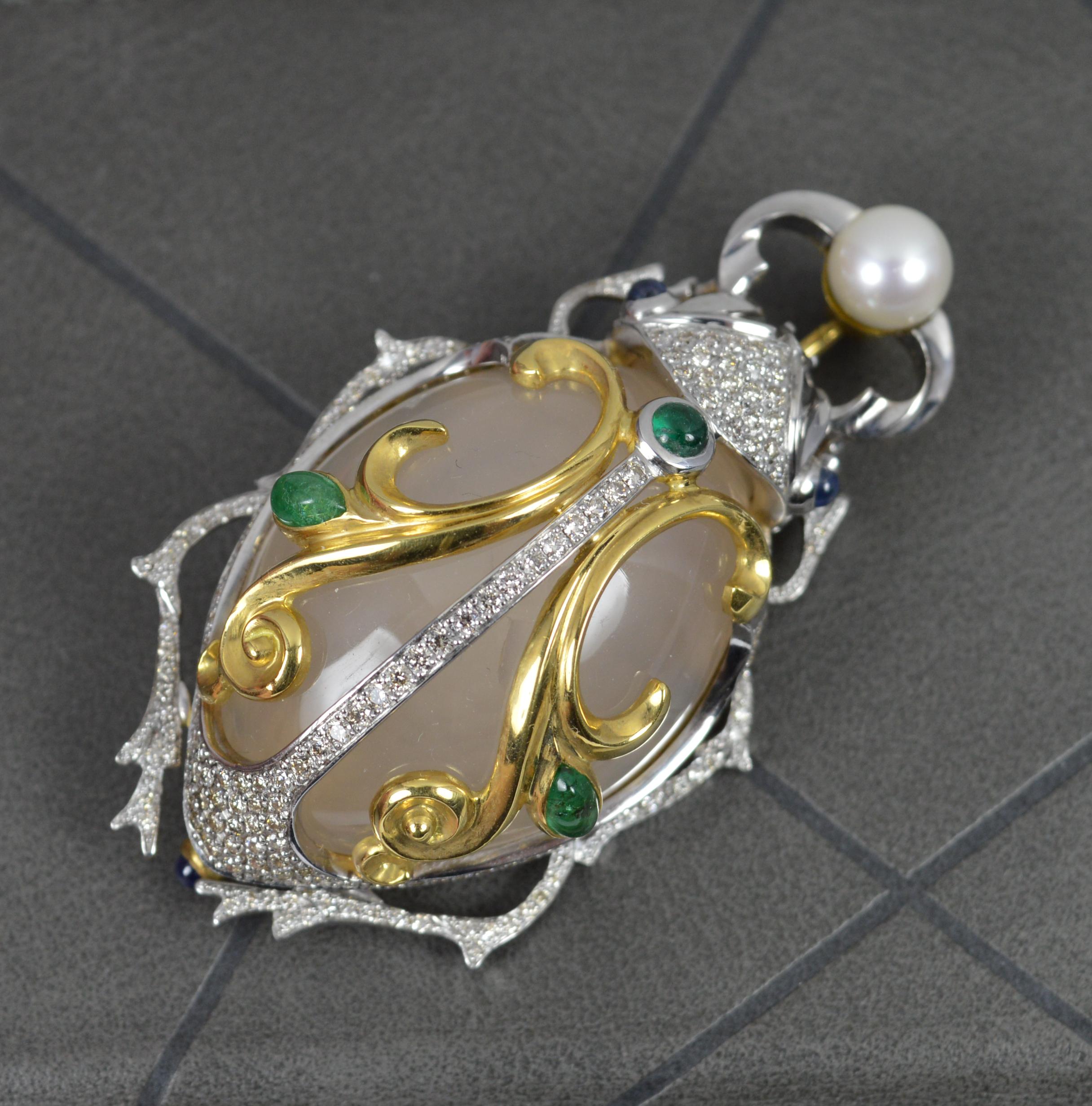 A stunning Beetle shaped brooch. 
Expertly crafted example.
Solid 18 carat yellow and white gold 
Designed with a pearl to top. The head, body and legs all pave set with many round brilliant cut, vs clarity diamonds, over 2cts. 
Complete with