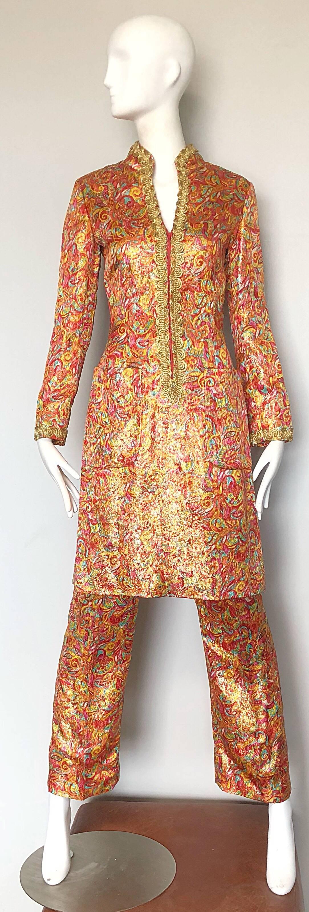 Incredible early 70s vintage NEUSTETERS mosaic print metallic tunic dress and flared leg trousers! Tunic dress zips up the front, and features gold embroidery around the collar, sleeve cuffs and down front center. Pockets at each side of the hip.