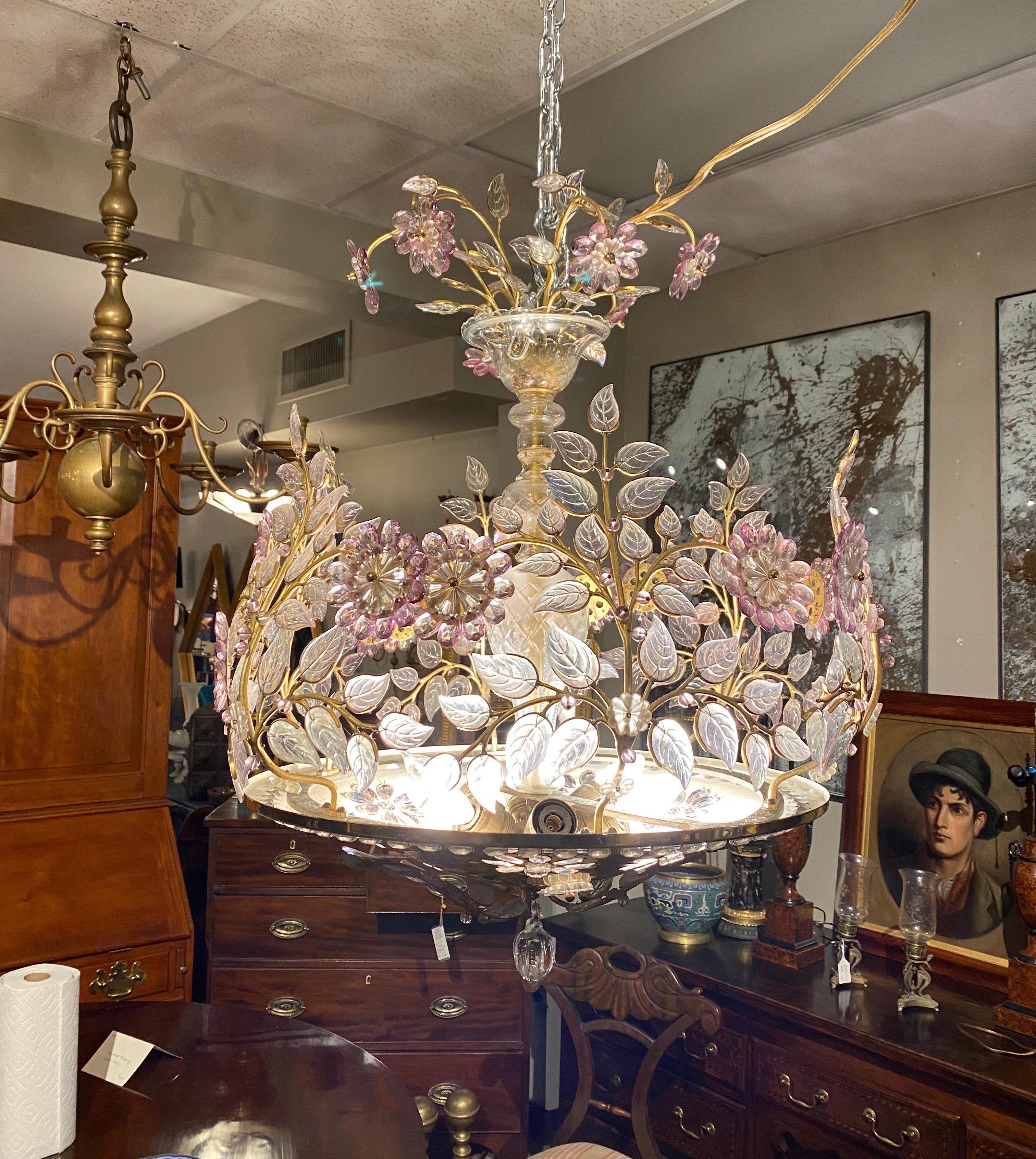 Incredible 6-light midcentury French chandelier by Maison Baguès. Wonderfully colored glass petals and leaves on scrolling bronze branches. Lights shine through the prisms inlaid into the brass bowl from beneath the chandelier.
     