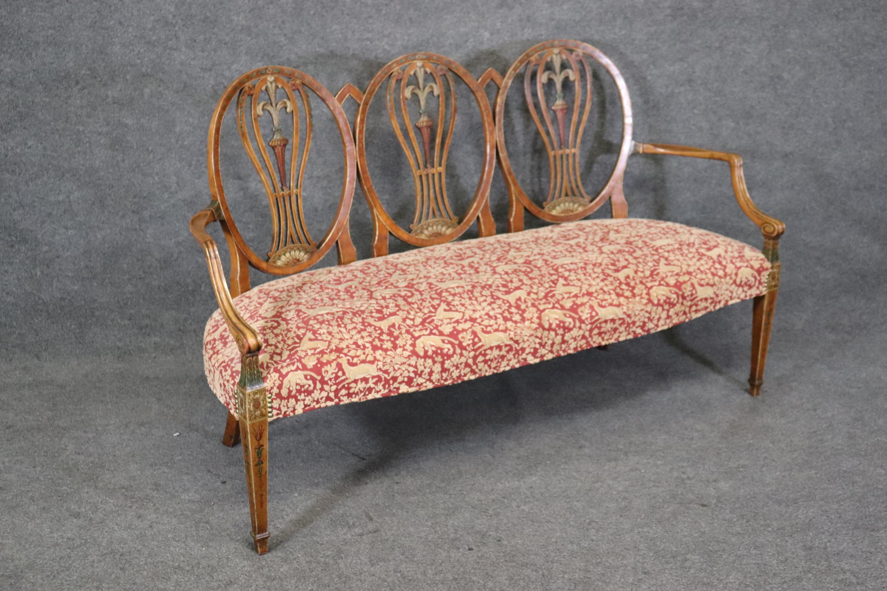 This is a fun and whimsical Adams settee with prancing deer on the upholstery and gorgeous painted decoration on the frame. The settee is a rare model with triple ovals and is a great size, a hard size to find. The settee measures 38 tall x 61.75