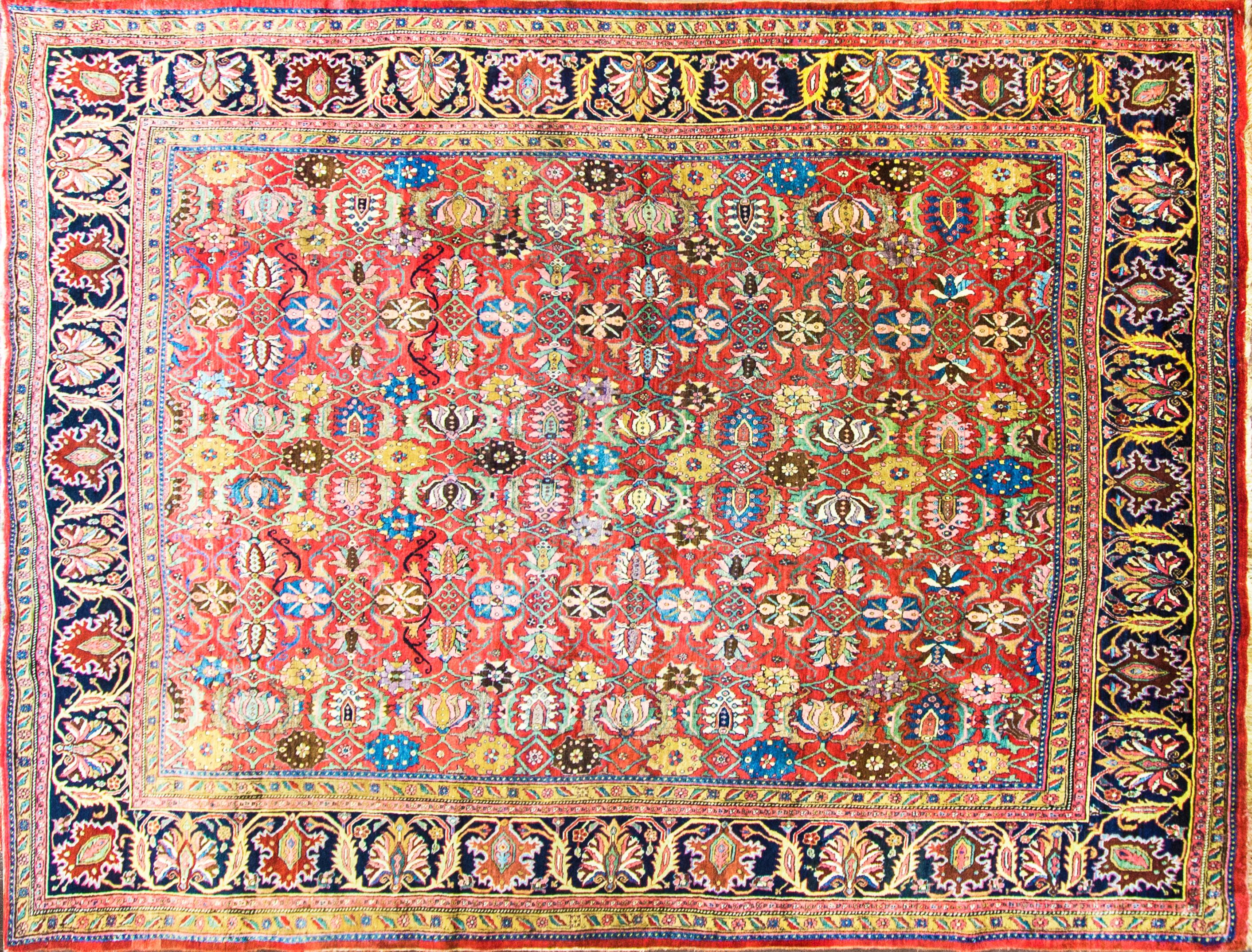 The description you provided details an impressive and collectible antique Persian Bijar Halwai carpet. Here's a summary of the key features and characteristics mentioned:

Size: The carpet measures 9 feet 2 inches in width by 12 feet 10 inches in