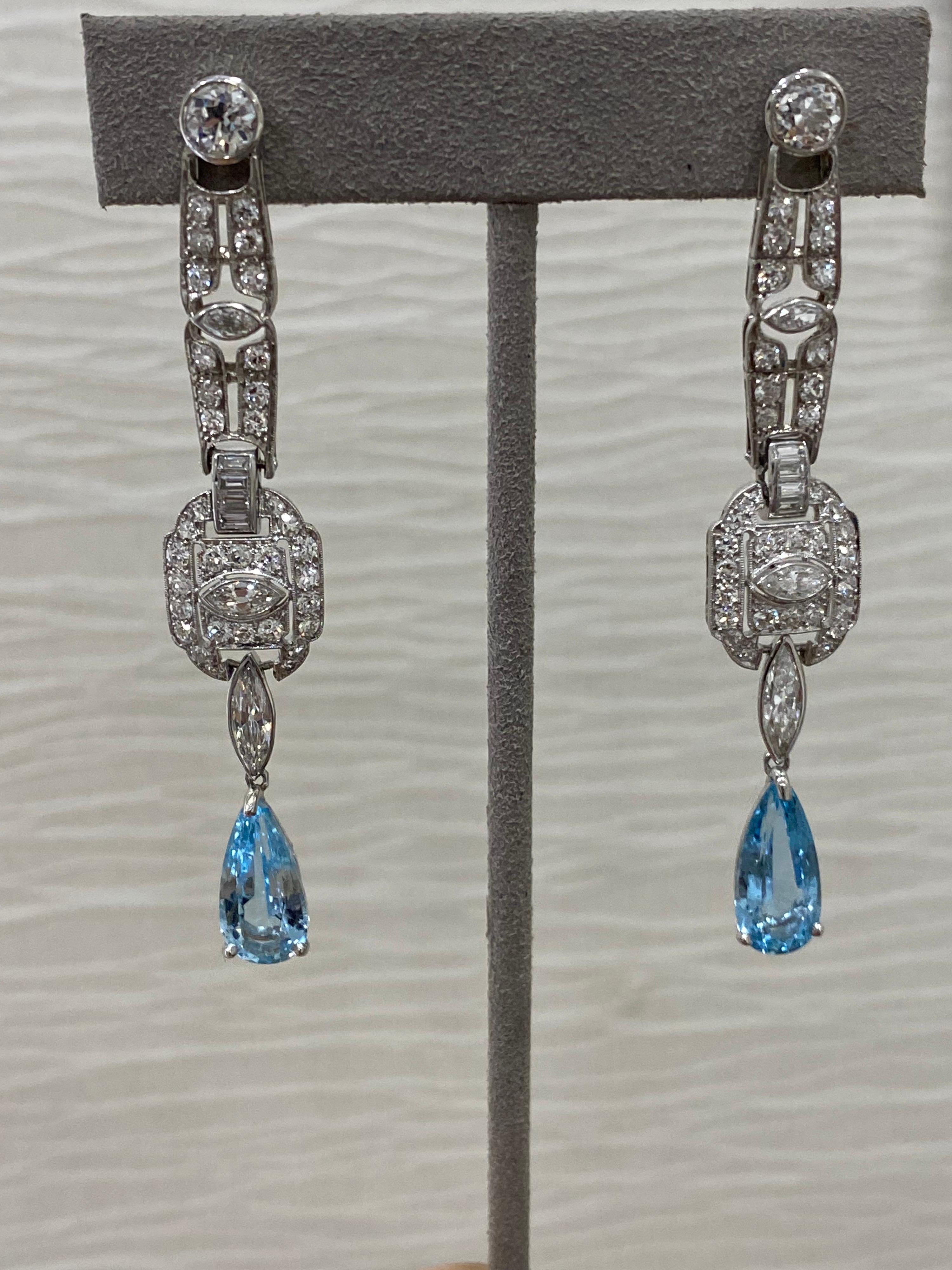 One- of-a- kind! These showstopper earrings were derived from original Circa 1920’s Art Deco pieces. They have been updated for modern wear. 
The aqua marines dangling on bottom are new and add the perfect amount of modern glamour. 
The Mindi Mond