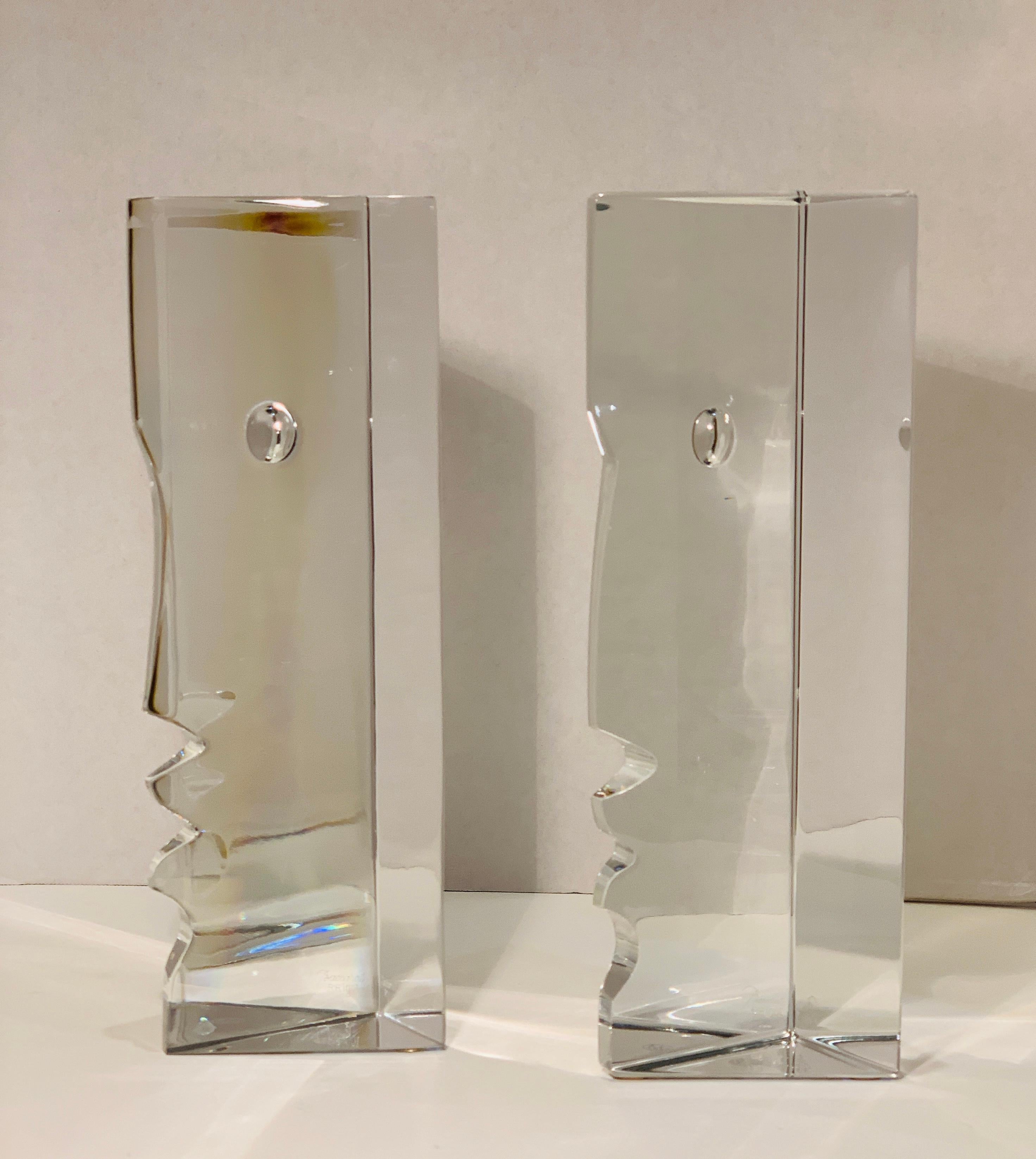 Fine estate Baccarat lead crystal sculptures depict a man and a woman, a couple about to exchange a kiss. Robert Rigot has taken a new look at the universal theme of love and designed two complementary sculptures for Baccarat. Cut in two blocks of