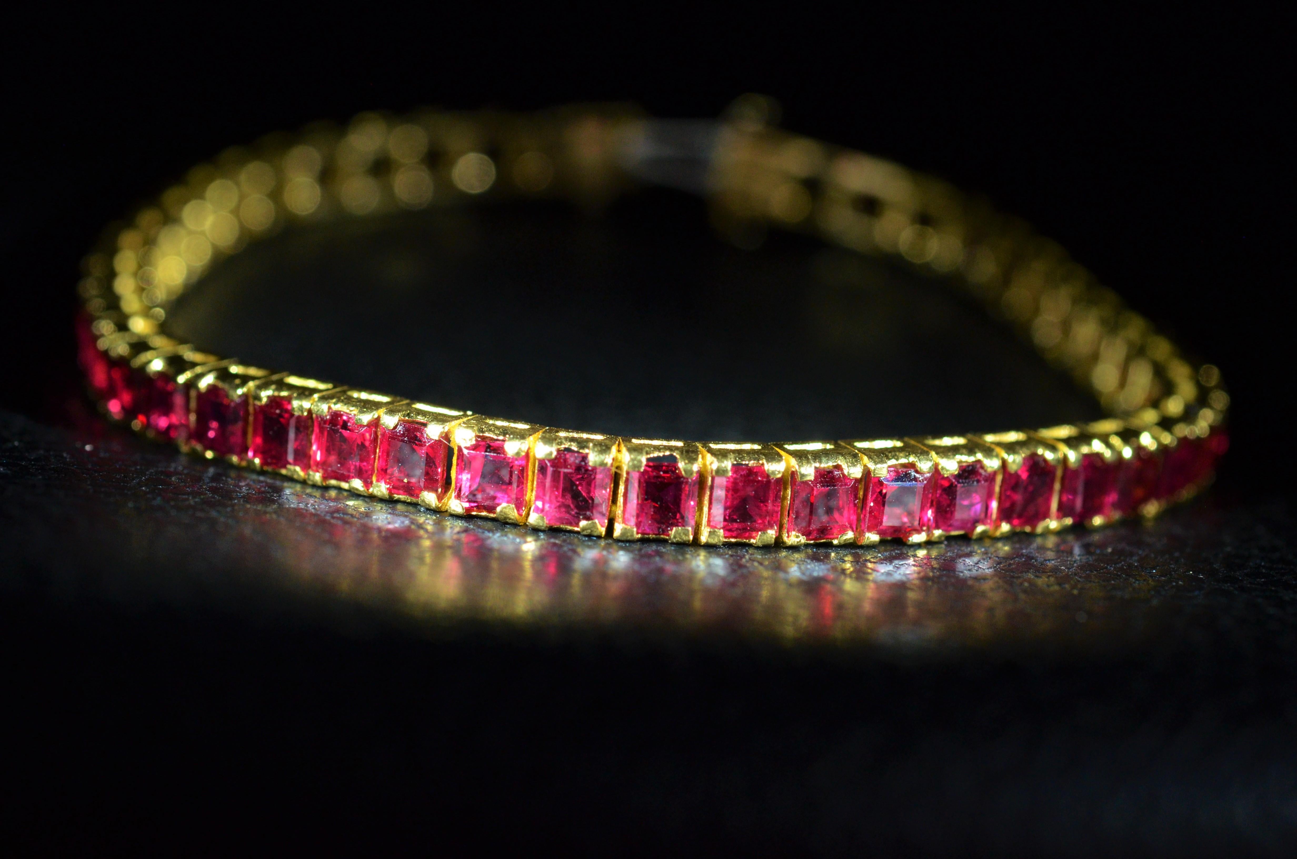 Incredible Burma Ruby Bracelet with Square Emerald Cut Rubies in 18 Karat In Excellent Condition For Sale In Warrington, PA