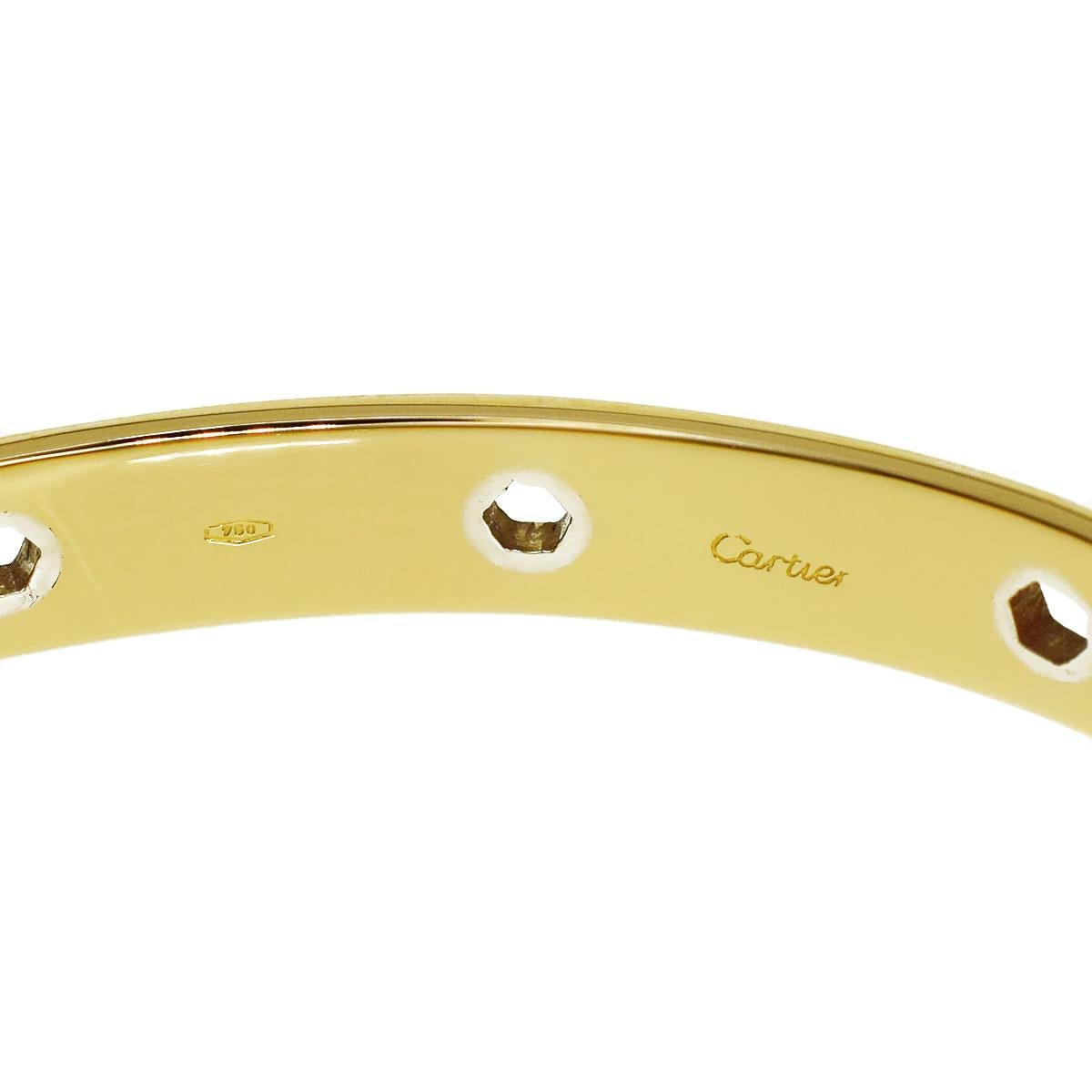 An incredibly rare Cartier Love series yellow gold bangle bracelet featuring hexagon white gold motifs embedded in 18k yellow gold. The bracelet measures 16cm, 6.29 