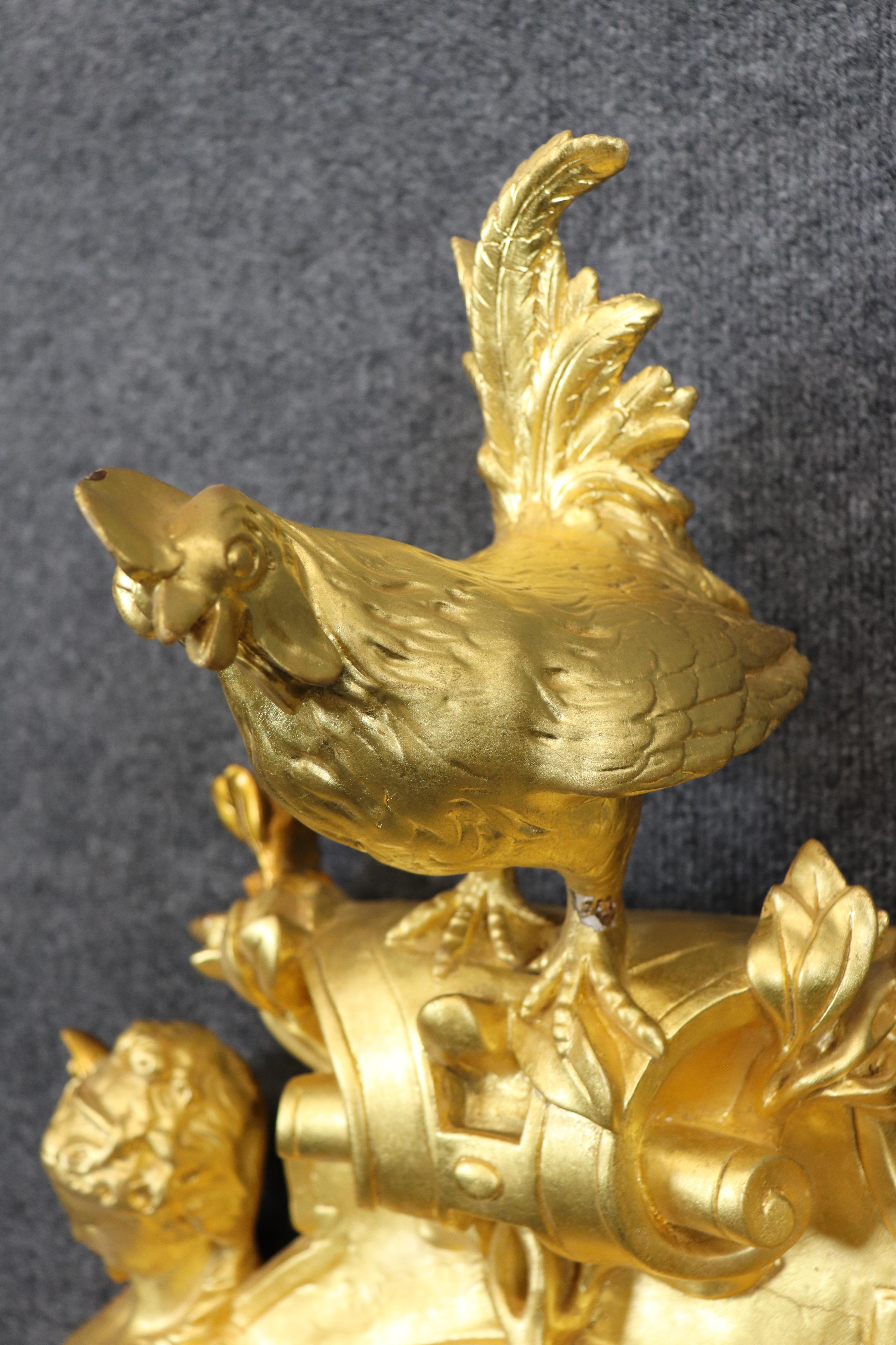 This is a gorgeous clock. The clock features a gorgeous carved walnut and gesso frame and is signed inside the movement. The gilded birds and winged angels are absolutely beautiful and naturalistically carved. The gold leaf is bright and luminous.