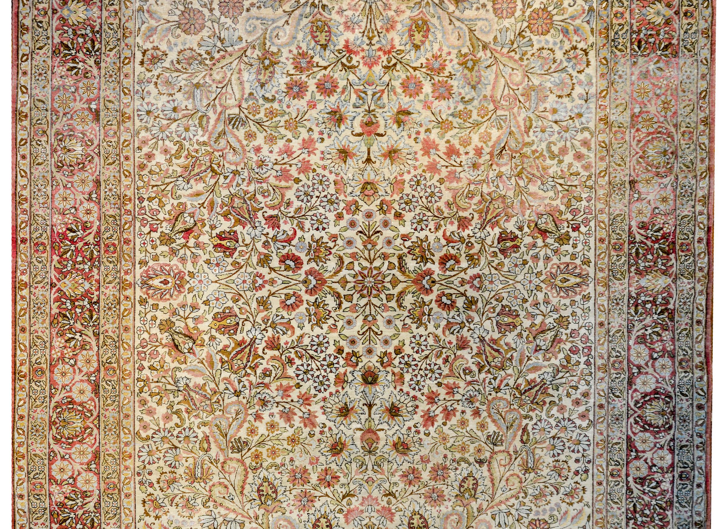 An incredible early 20th century Persian Lavar Kirman rug with an absolutely stunning all-over tree-of-life pattern with myriad floral varieties, scrolling vines, and leaves.