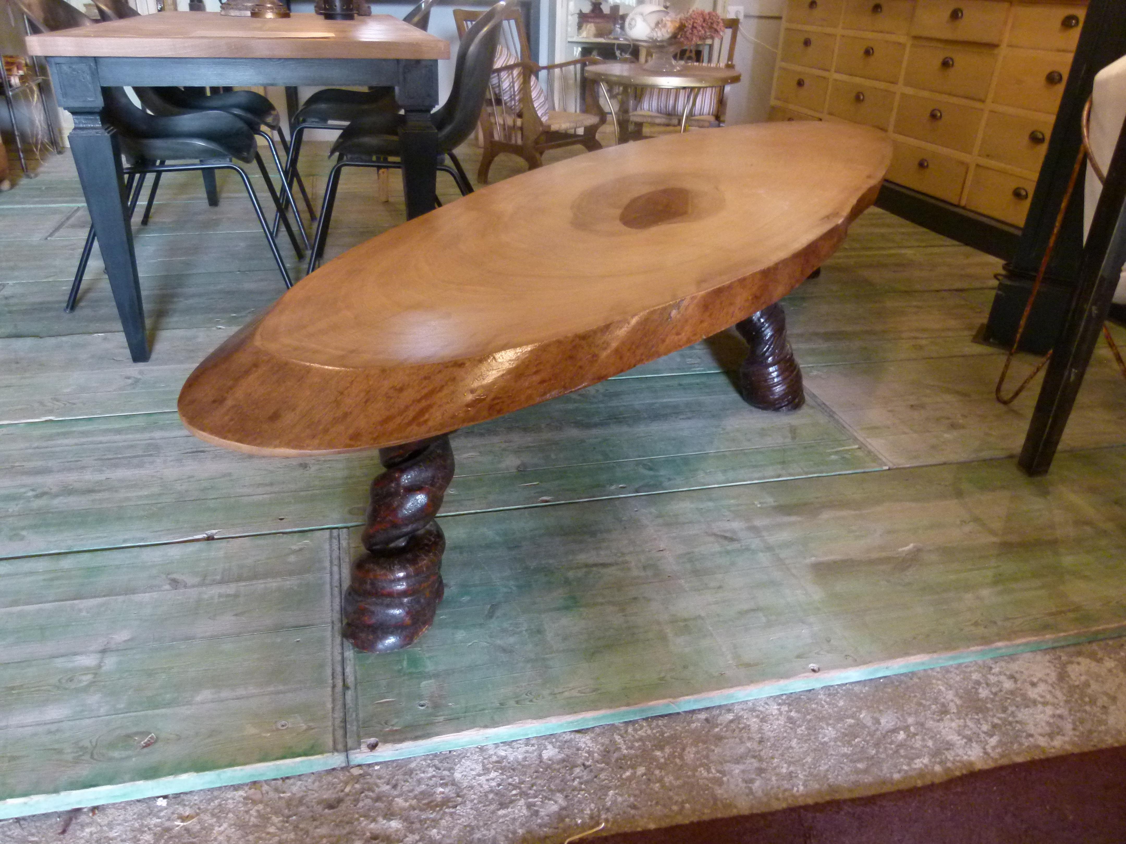Incredible table from Congo. Made from Baobab's wood and legs from Liana.
Baobabs reach heights of 5 to 30 m (16 to 98 ft) and have trunk diameters of 7 to 11 m (23 to 36 ft).Baobabs store water in the trunk (up to 120,000 liters or 32,000 US