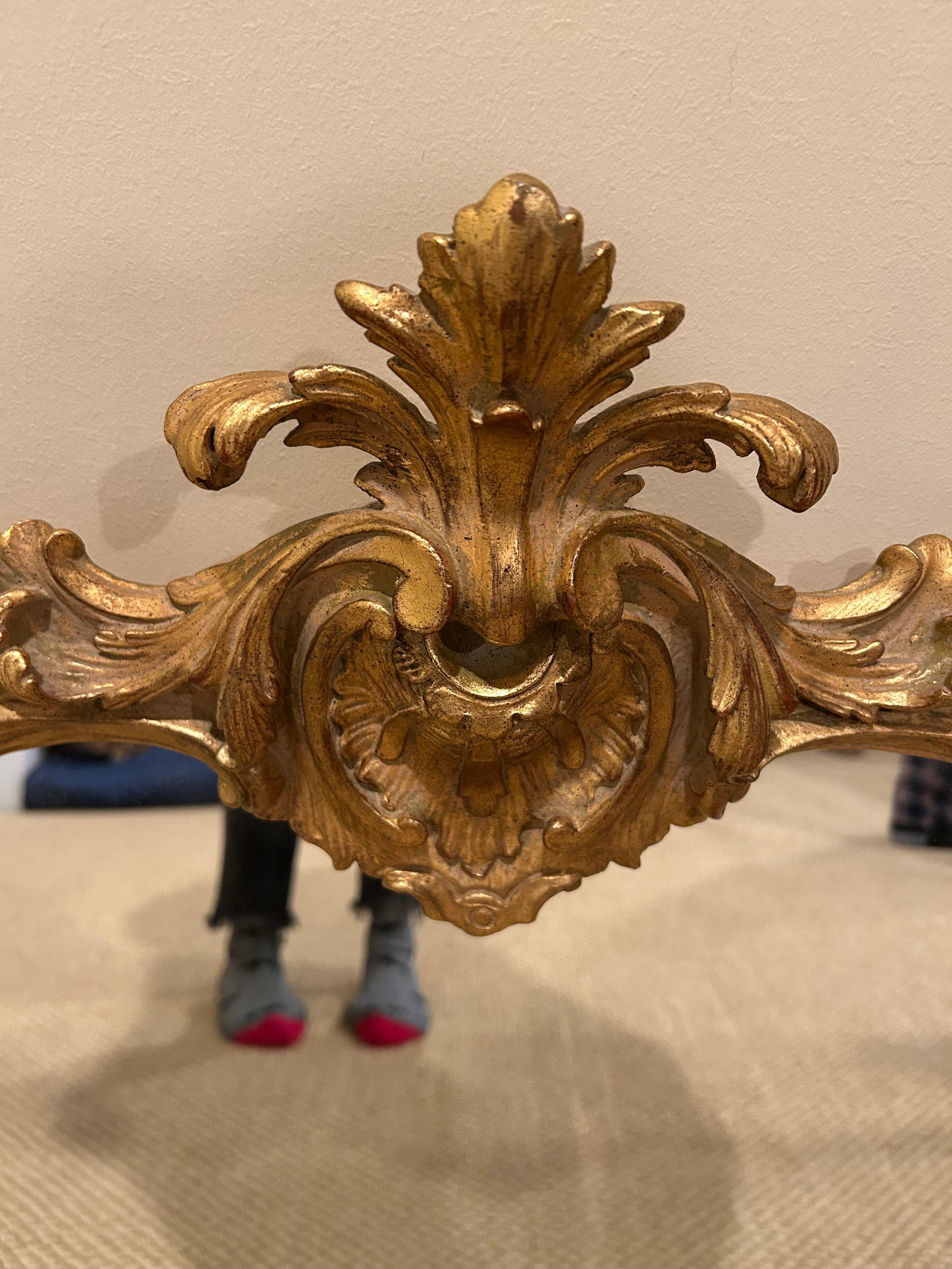 Impressive large horizontal mantel mirror having gesso gold leaf fancy French style.