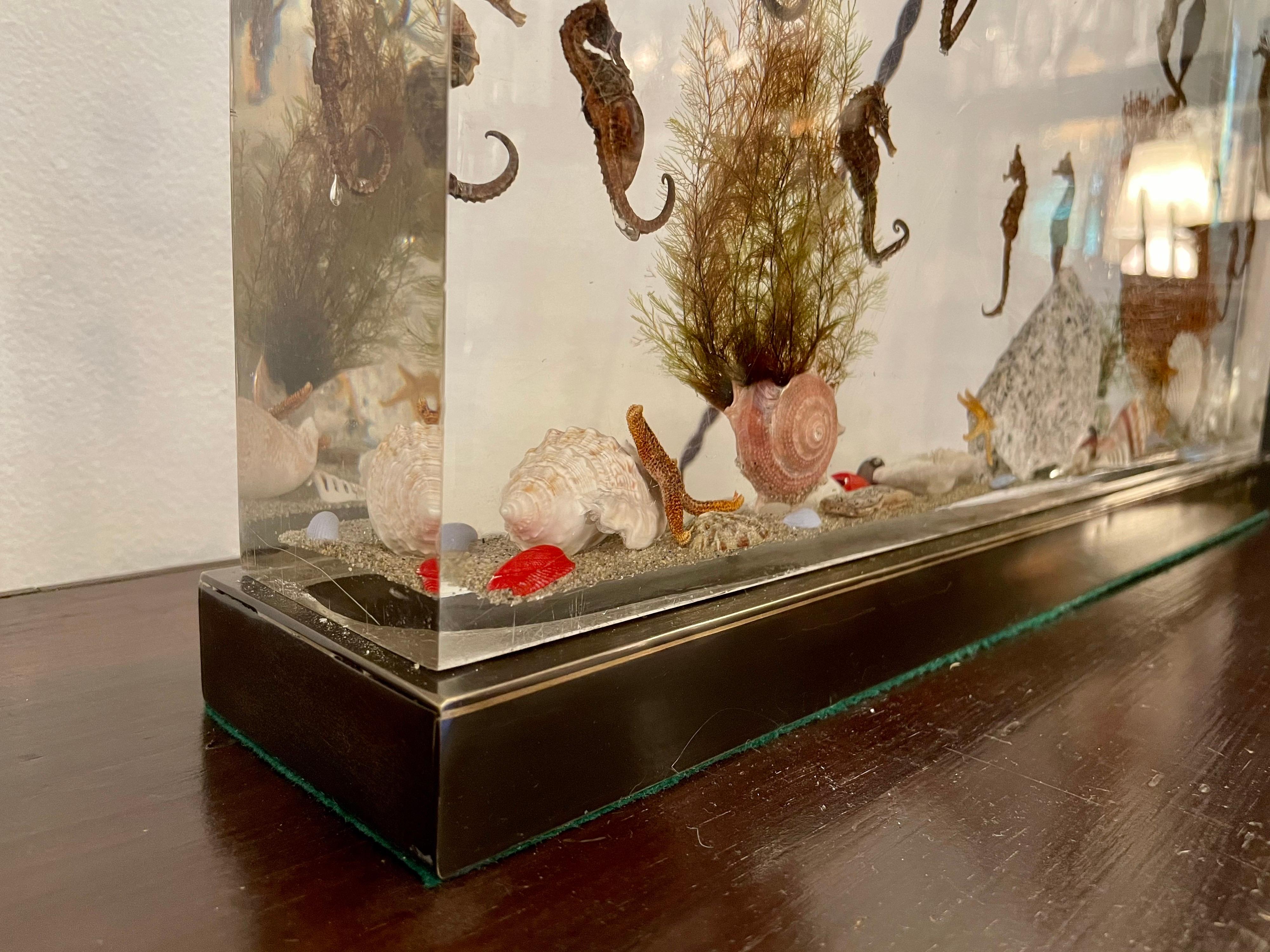This is an 18.5 x 9 inches block of Resin of an aquarium scene with seahorses, seashells, rocks, etc. Very clean and heavy but 100% vintage. This is mounted on bronze finish base and rewired with double cluster sockets and silk cable. Really a