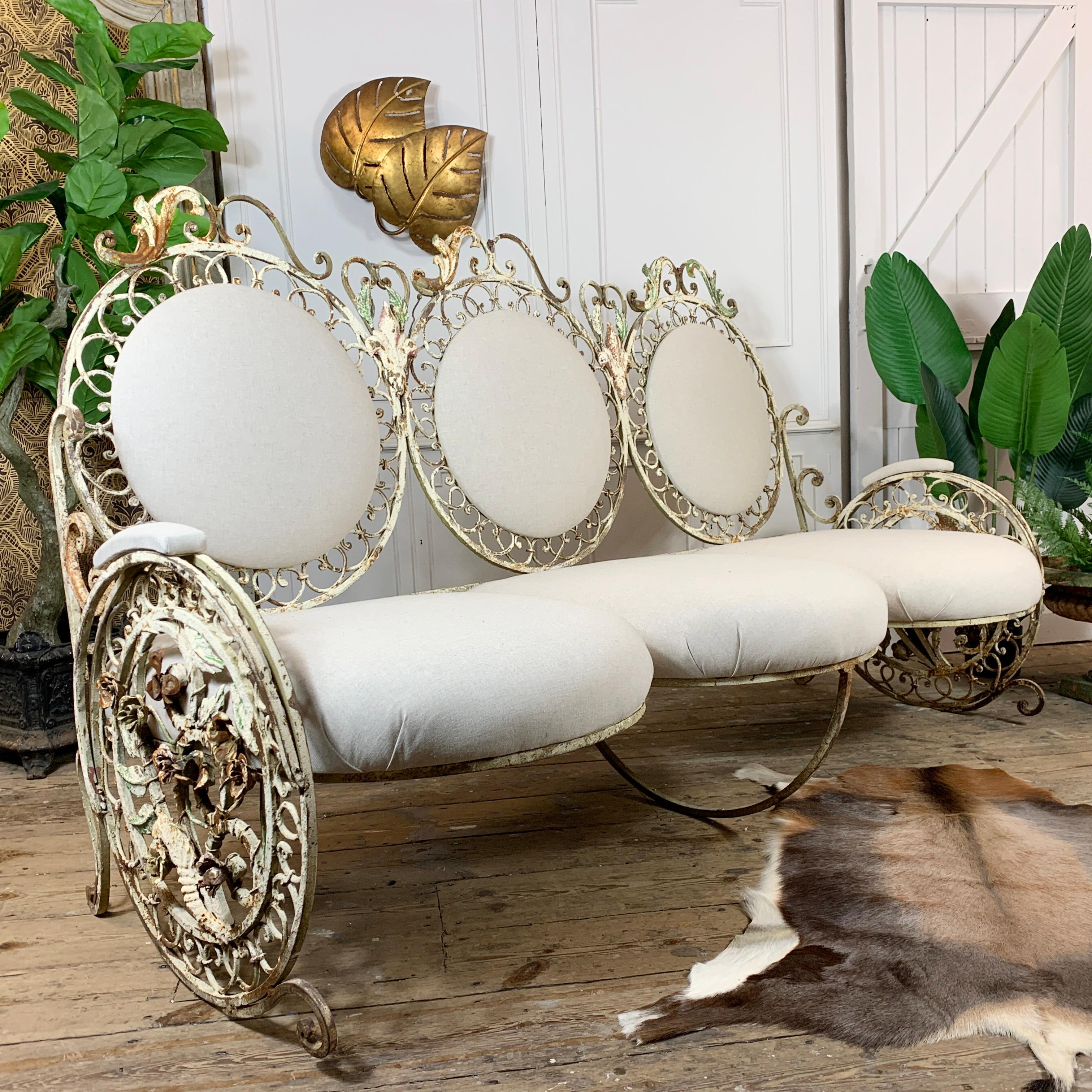 A quite exceptional late 19th century pair of French patio/orangery Settee.

This is a beautiful wrought iron large settee, with the most intricate decorative detailing and workmanship throughout. An abundance of flowers and leaves decorate the