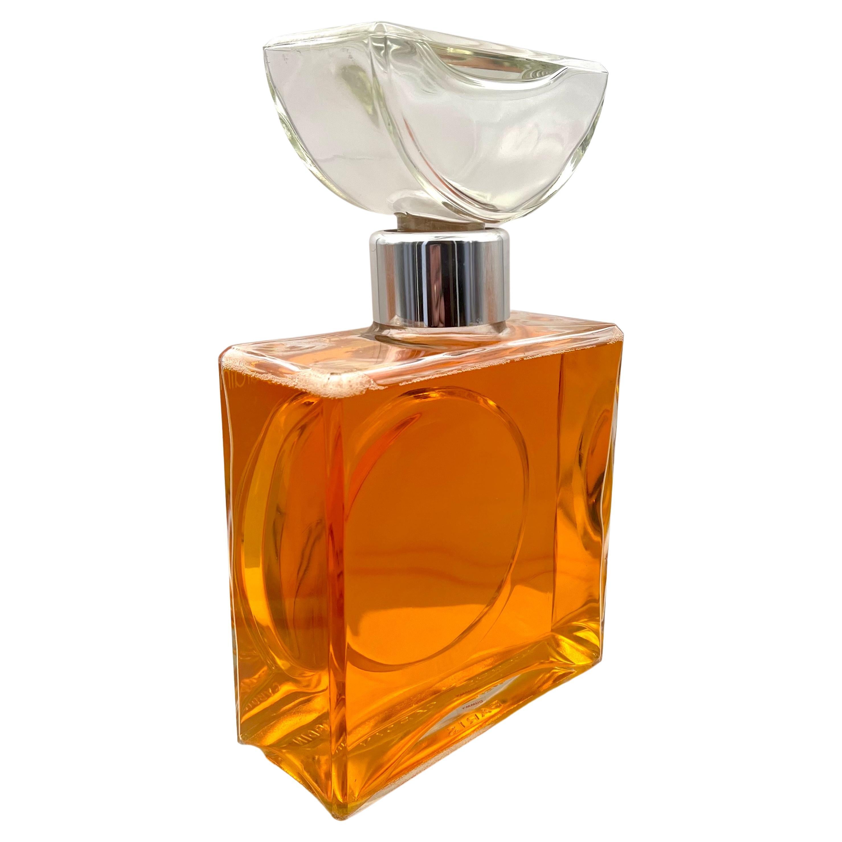 Authentic incredible large display perfume bottle by Pierre Cardin France, made of glass with liquid in excellent condition.