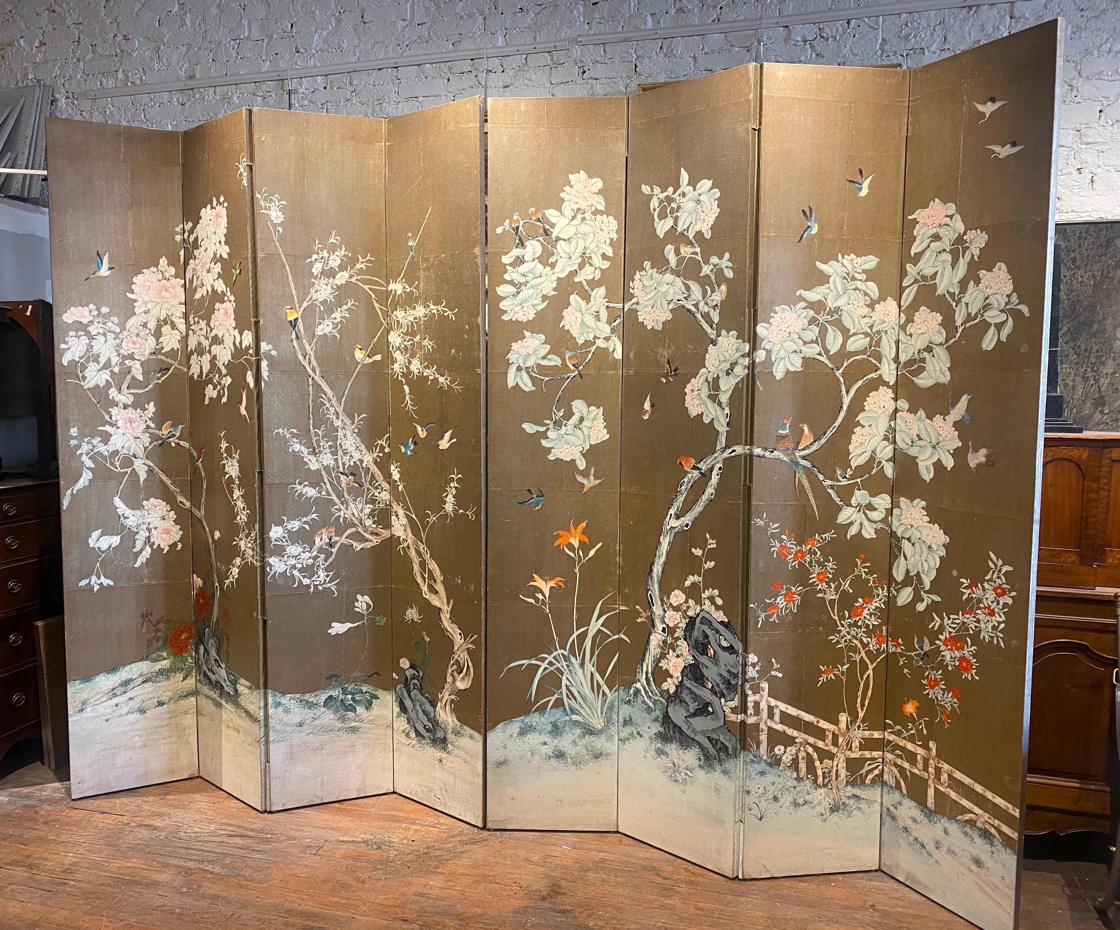 Incredible midcentury 8-panel hand painted gold leaf screen, probably by Gracie.

2 sections of 4 connected panels with a continuous scene of various birds and flowers. Standing 8’8” high, each panel is 19” wide. 

In addition to being used as a