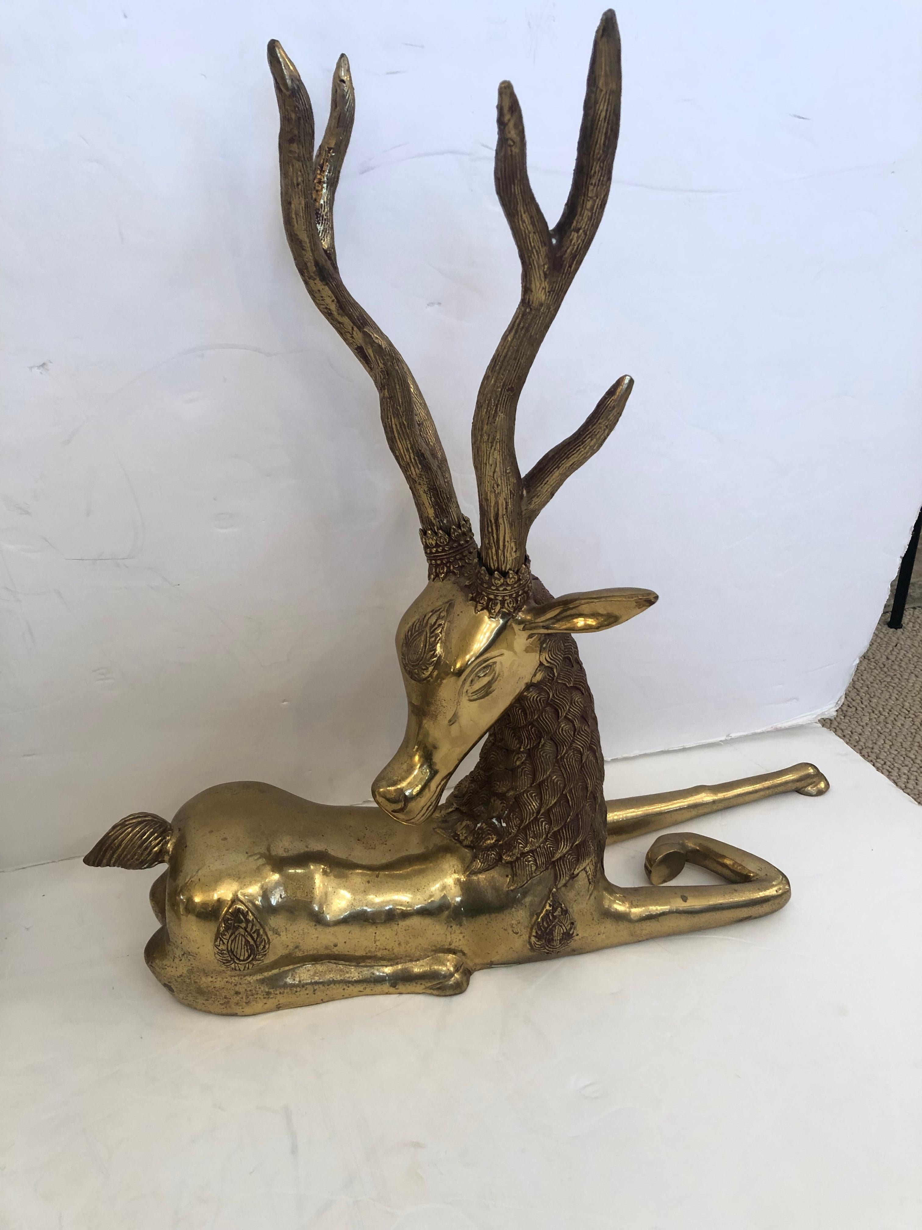 Chinese Incredible Pair of Solid Brass Reclining Stags with Impressive Antlers For Sale