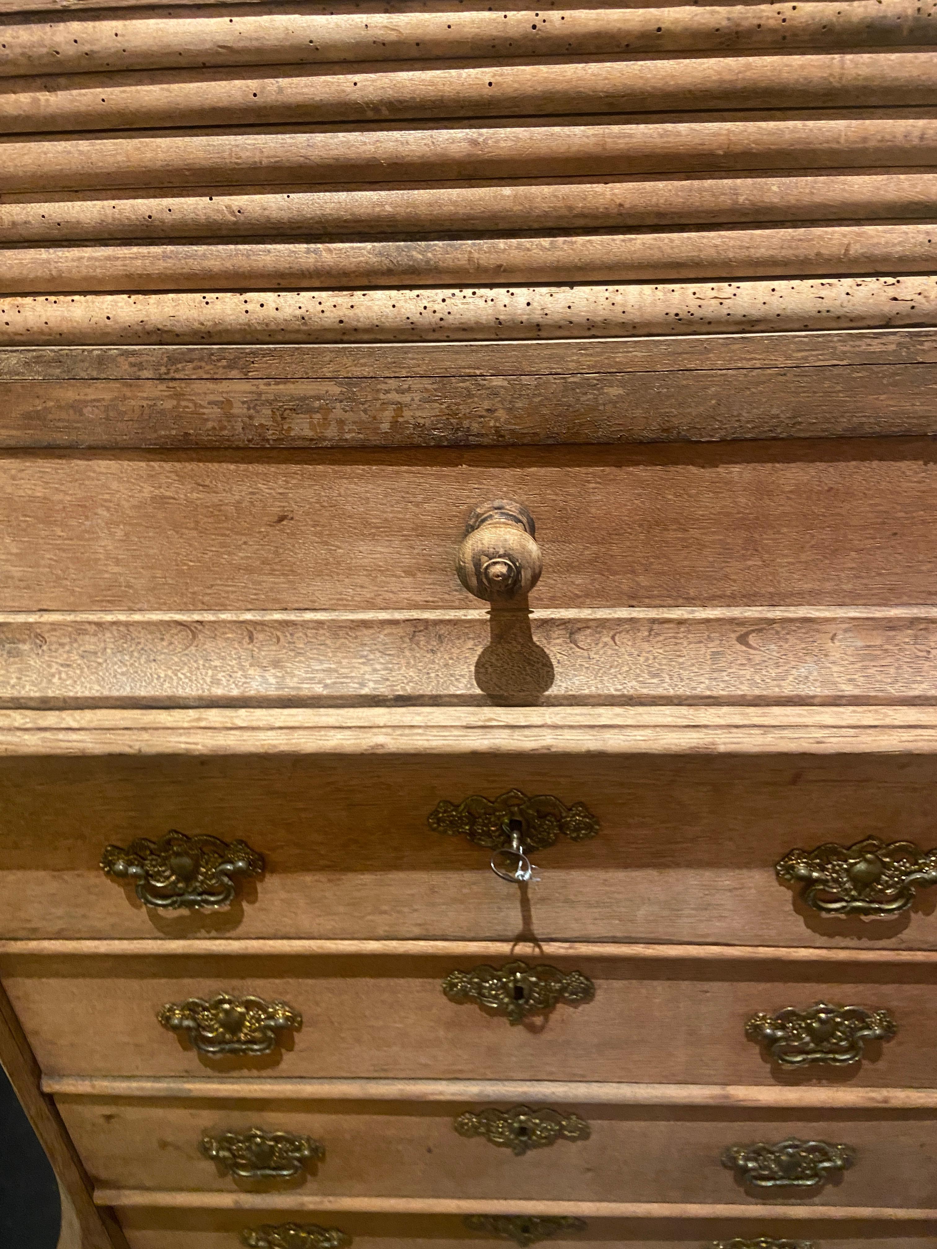 This rare Dutch linen press is a remarkable piece of furniture that combines functionality with exquisite craftsmanship. Crafted in the Netherlands, this linen press showcases the distinctive design elements and attention to detail that are
