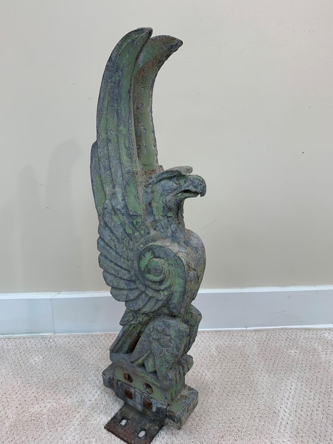An incredibly rare Art Deco galvanized over iron sculptural eagle. This eagle most likely was mounted on a column of a bridge or possibly a building. It has been painted over the years but is still in very good condition. It has phenomenal Art Deco