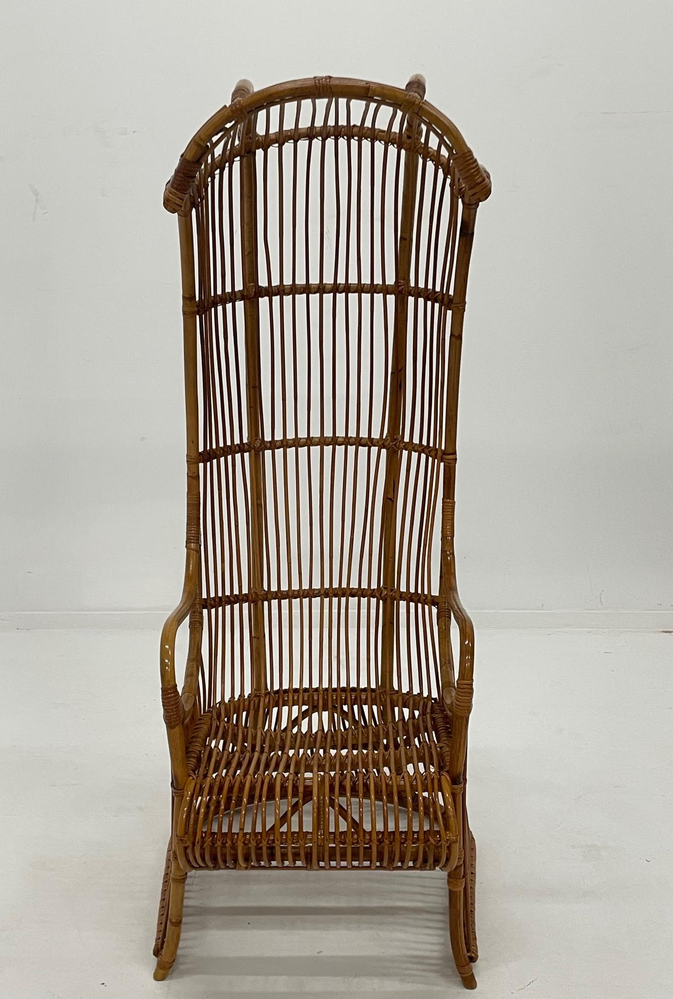 The show stopper chair in the room is this sculptural elongated rattan Porters chair with fabulous curved top. It's stunning from every angle. Comfortable too. A true work of art in design.
Measures: seat depth 21
arm height 26.