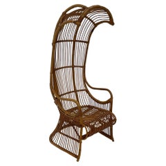 Incredible Rare Vintage Rattan Porters Chair with Sculptural Silhouette