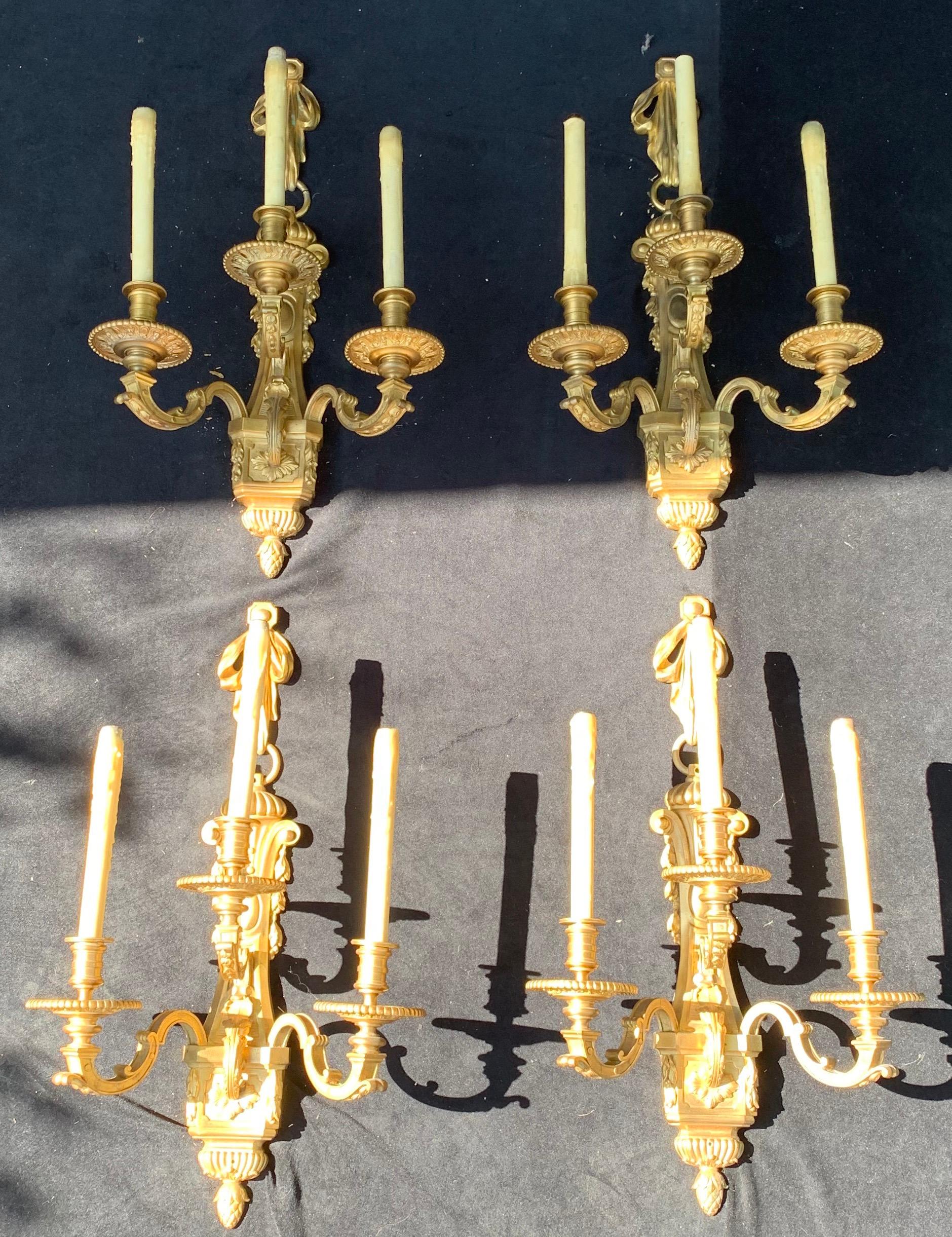 Incredible quality set of 4 large French doré bronze neoclassical style bow and tassel 3 candelabra sconces in the manner of Henri Vian
The set of four (two pair) came out of the same estate on the gold coast of long island where the Signed Henri