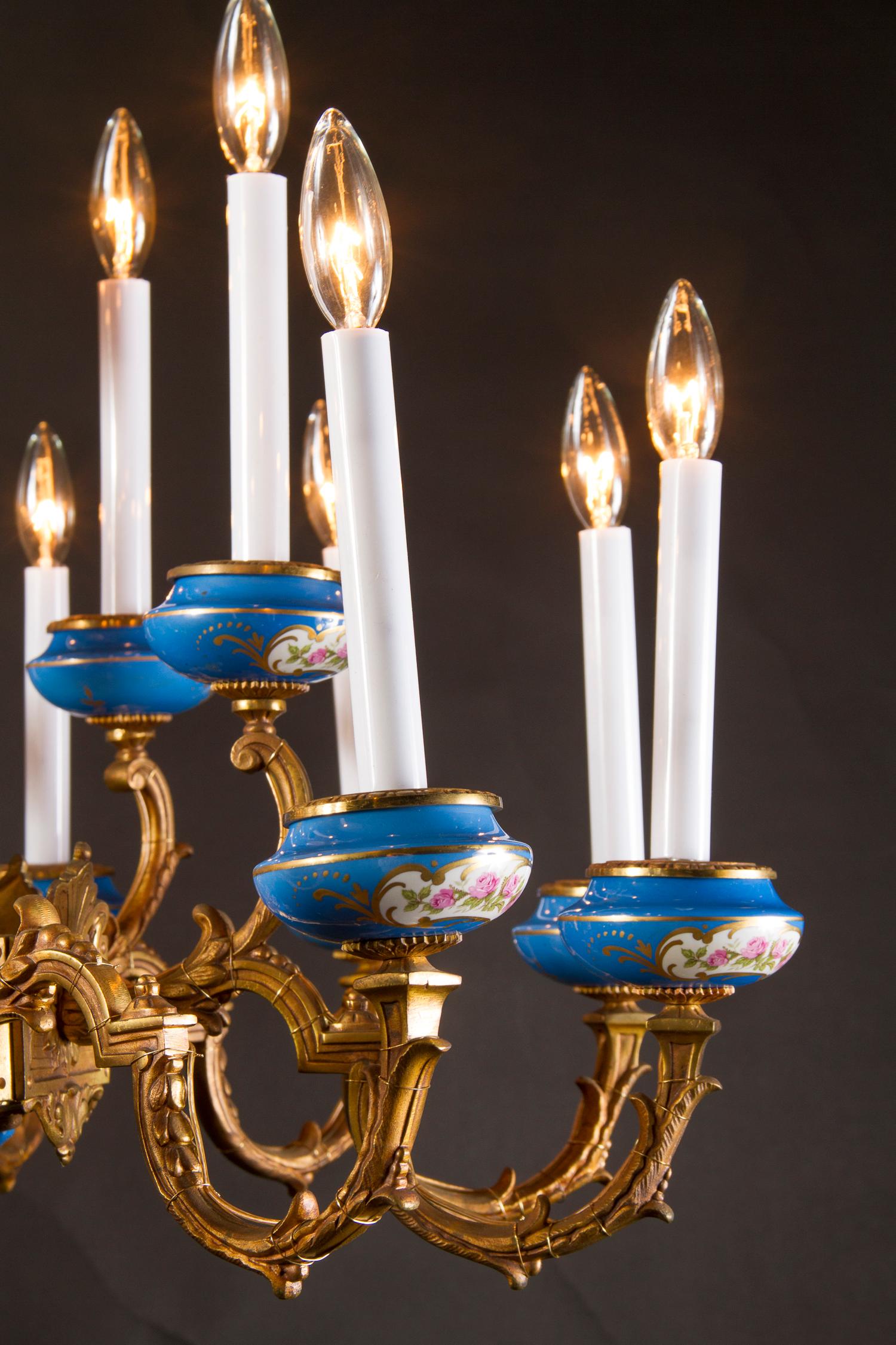 This 19th century French chandelier is an immaculate example of Sevres Porcelain in lighting. Sevres, both a city in France and one of the most highly regarded porcelain manufacturers is known for just that, creating immaculate porcelain. The stamp