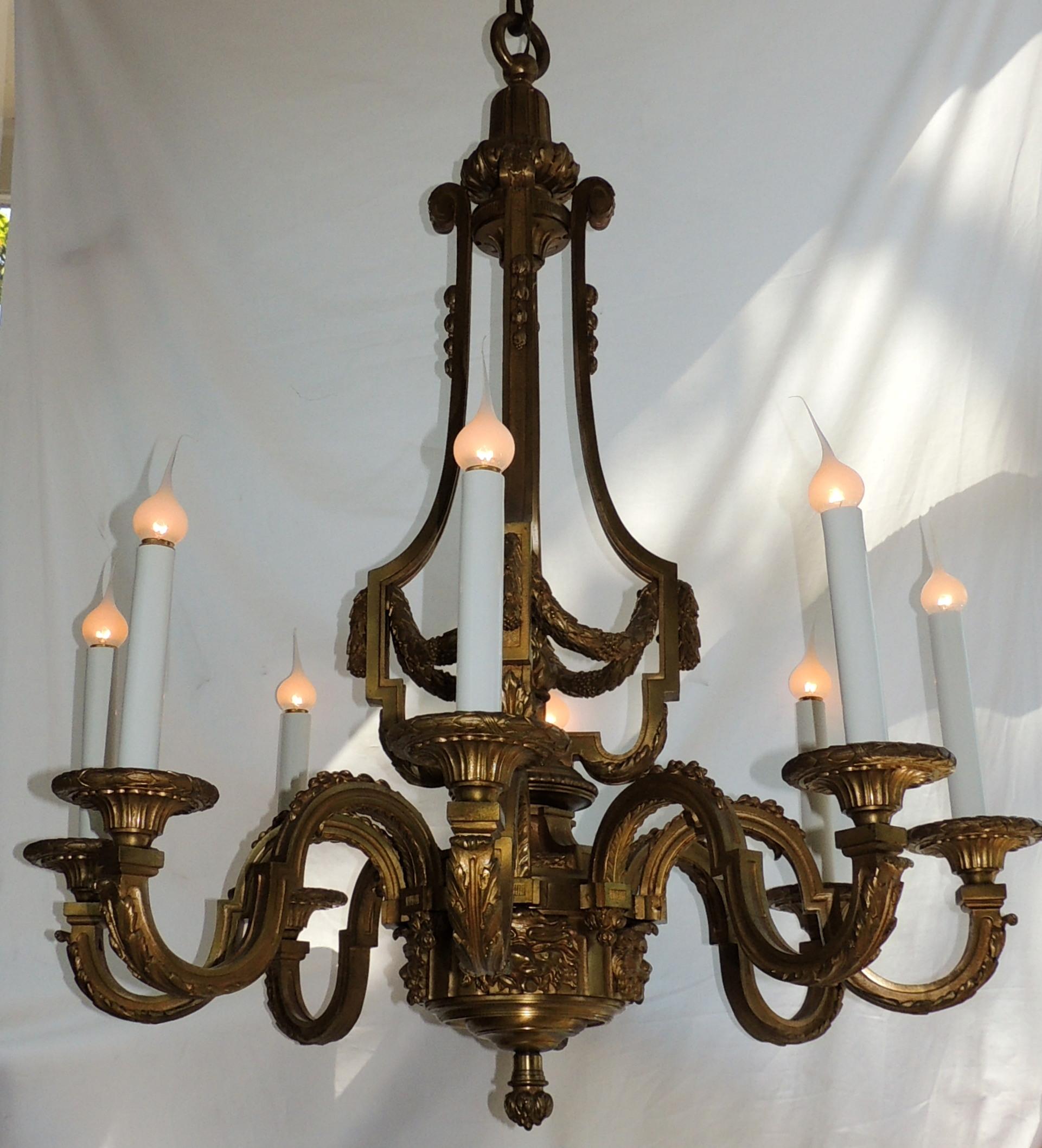An Incredible signed Henri Vian French doré bronze neoclassical eight-light chandelier.
Henri Vian, (1860-1905) was a celebrated Parisian bronzier, specializing in the production of bronzes in the eighteenth century style and interior ornamentation
