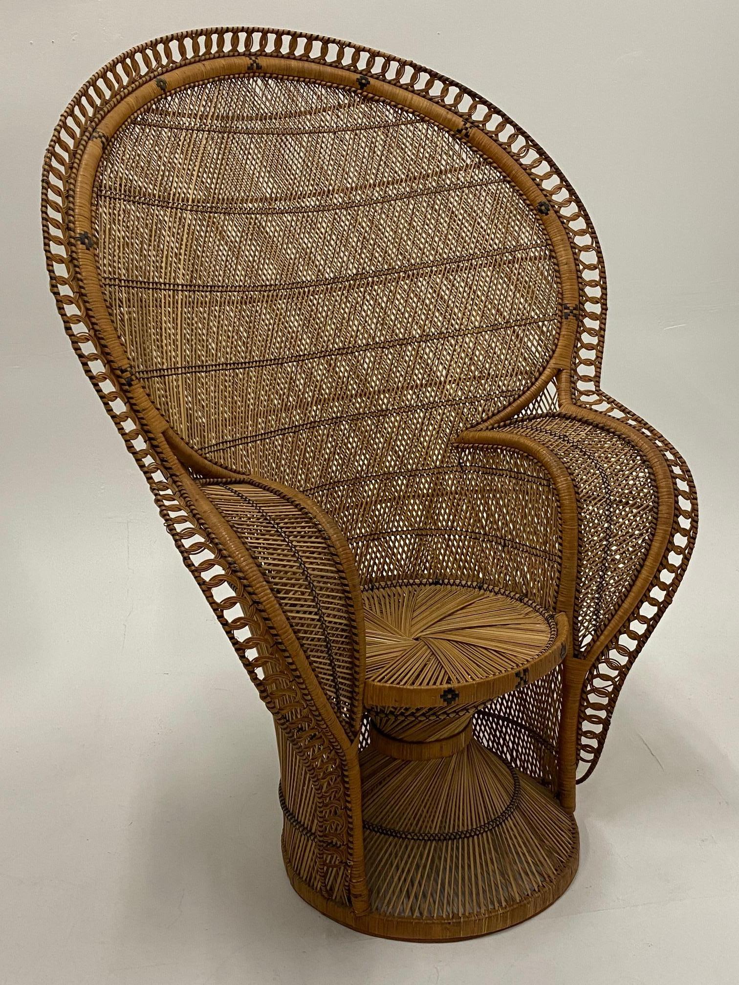 The finest one we've seen in a superb, large, and extremely detailed cobra peacock chair made of woven rattan.