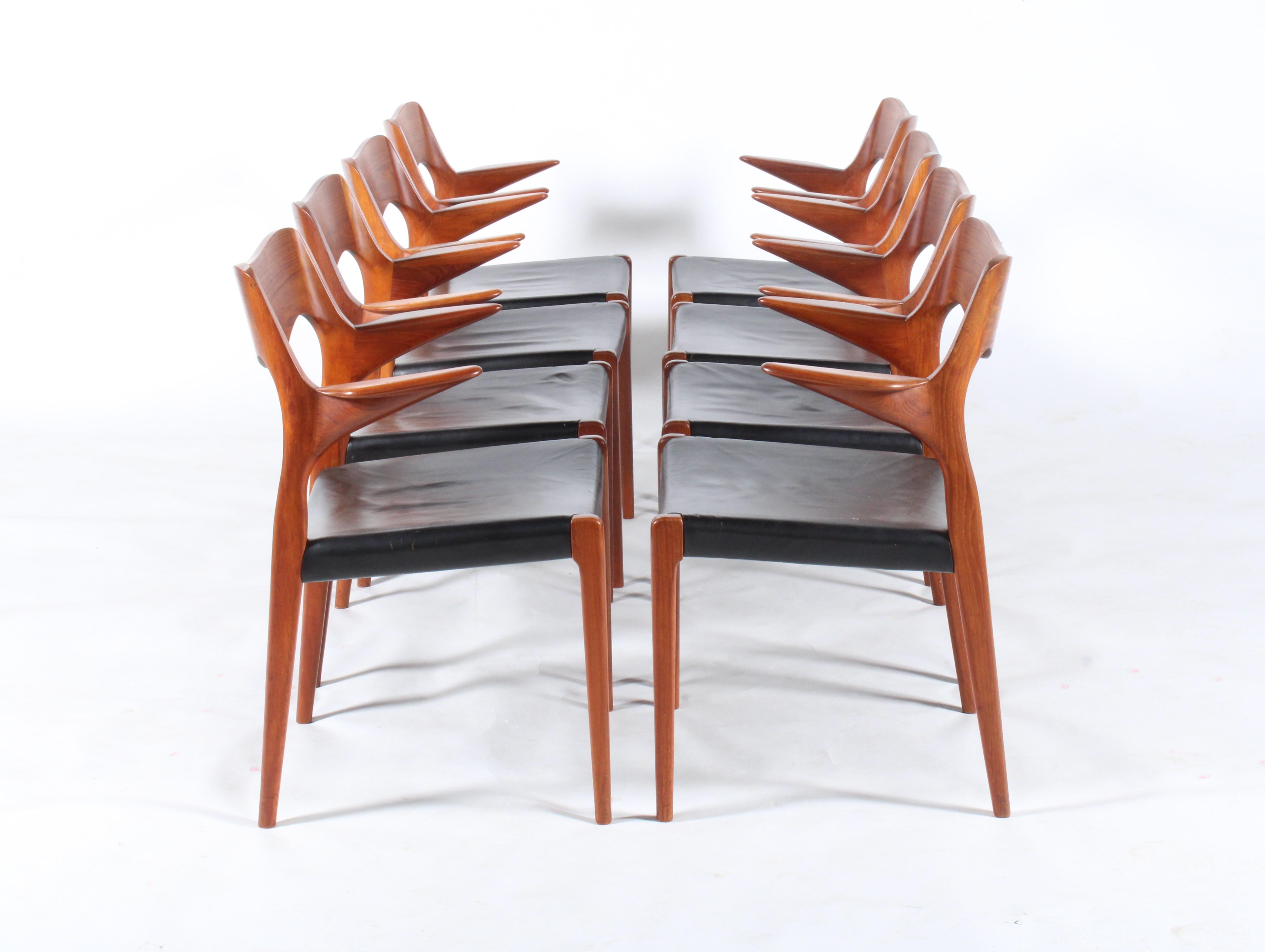An incredibly rare and beautiful set of eight Model 55 dining chairs by legendary Danish design icon Niels Otto Moller. This wonderful set are offered in superb untouched vintage condition and all have their original vinyl seat covering . Over the