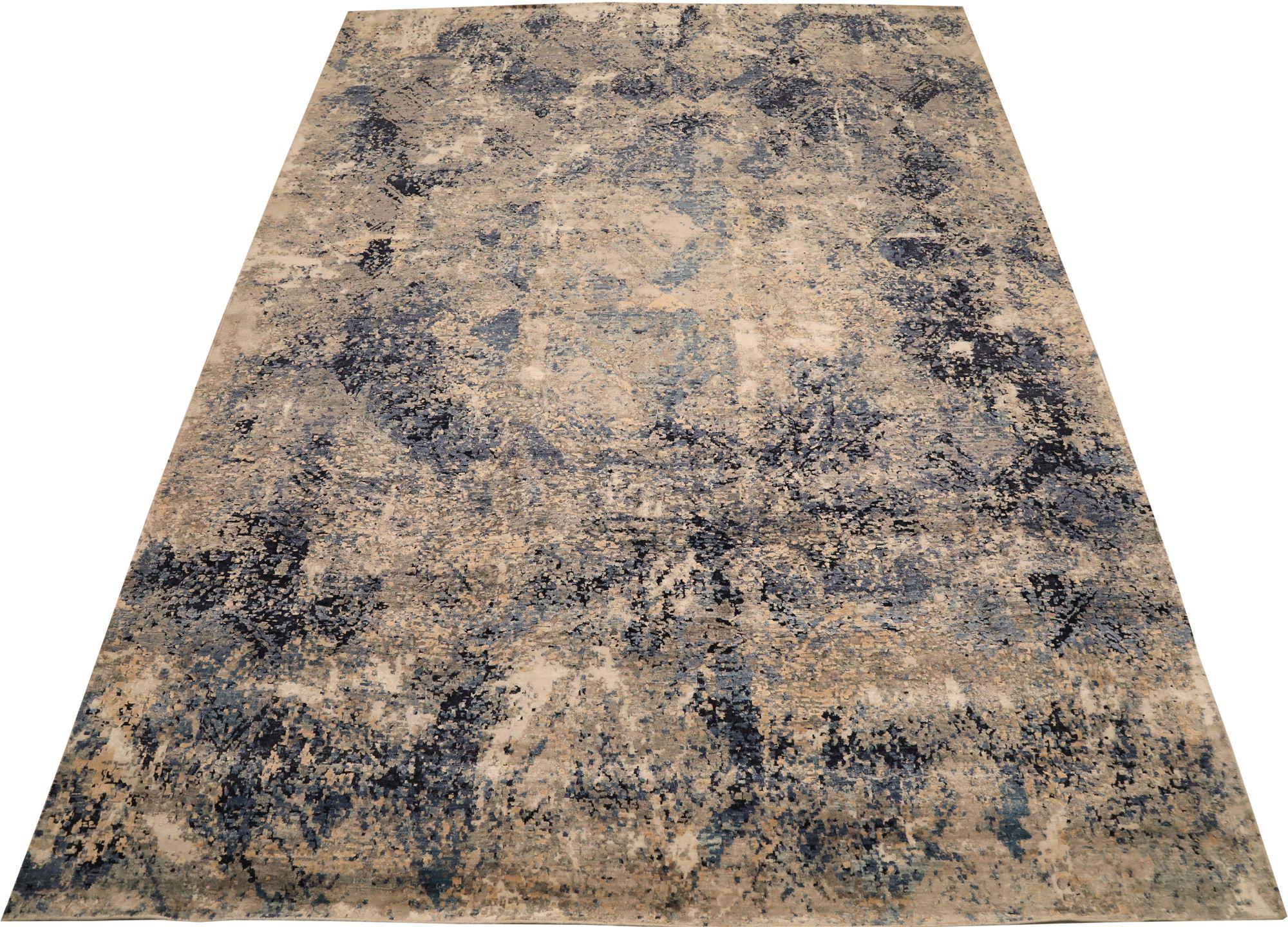  A Modern Indian Wool Area Rug 

This extraordinary rug manifests dynamic abstract expressionism and cool chromatic energy. Its bold, painterly design and distressed texture provide an unparalleled foundation of artistic depth and visual intrigue