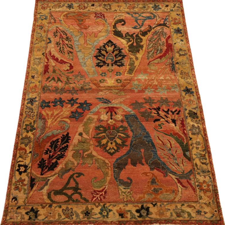 The Exquisite Artistry of an Antique Persian Sarouk Rug
This magnificent area rug is a rare and breathtaking example of the highest form of Persian weaving art. It is an authentic antique or vintage Persian Sarouk Farahan, a style revered by