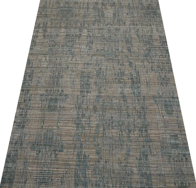 Découvrez l'élégance de l'Inde avec les tapis de sol de Circa 1990. Conçu avec de la laine et du BlueGreenIvoryTaupe, ce design exclusif est parfait pour mettre en valeur votre espace.