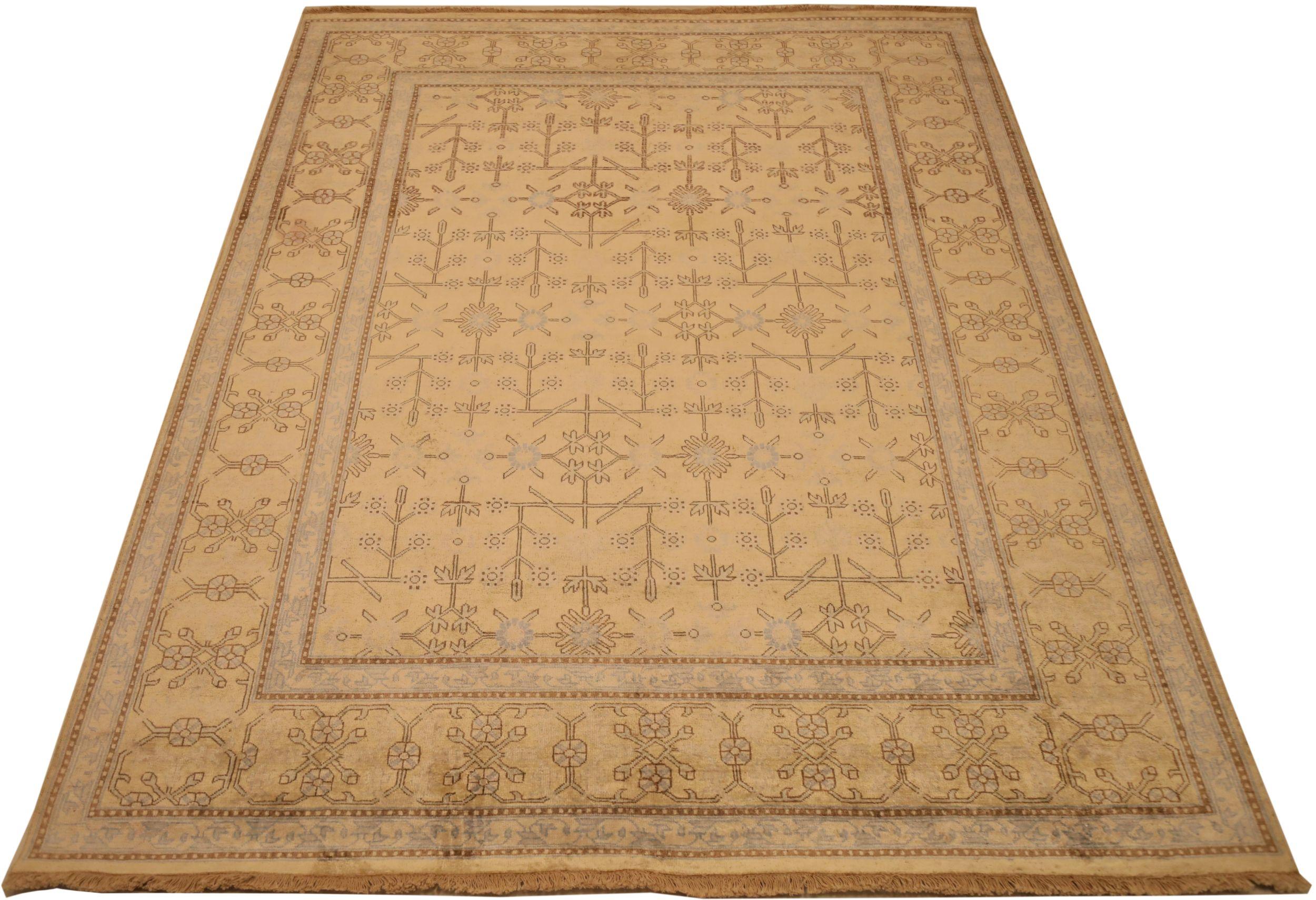 Découvrez l'élégance des tapis de l'Inde Khotan, datant de 1990. Conçu avec de la laine et du Design/One, ce design exclusif est parfait pour mettre en valeur votre espace.
