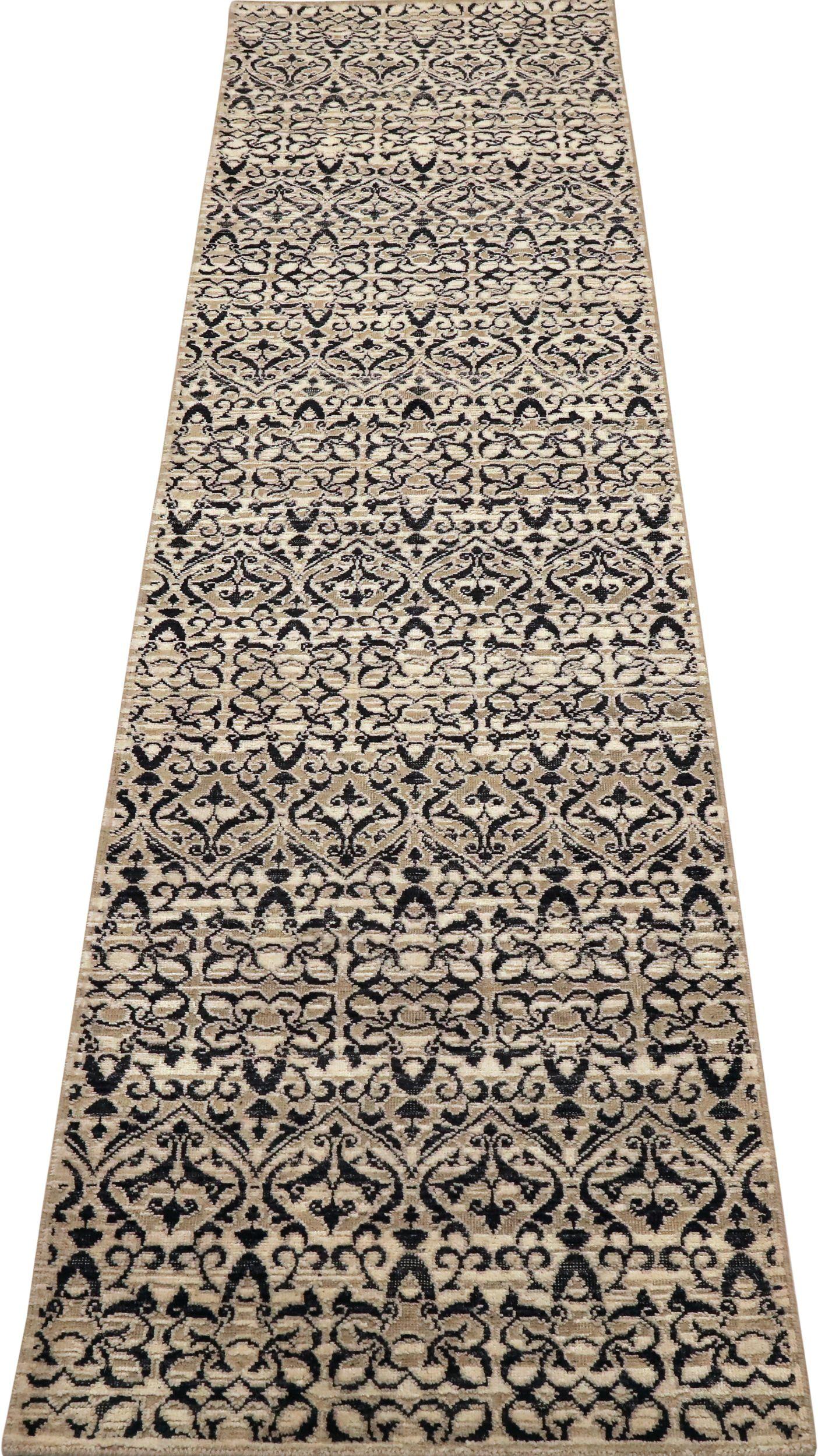 Elegant Indian Runner Rug: A Classic Tapestry of Bold Black and Cream Scrollwork

A Linear Canvas of Striking Contrast and Intricate Design
This captivating Indian runner rug immediately commands attention. Its elongated field, a dramatic black,