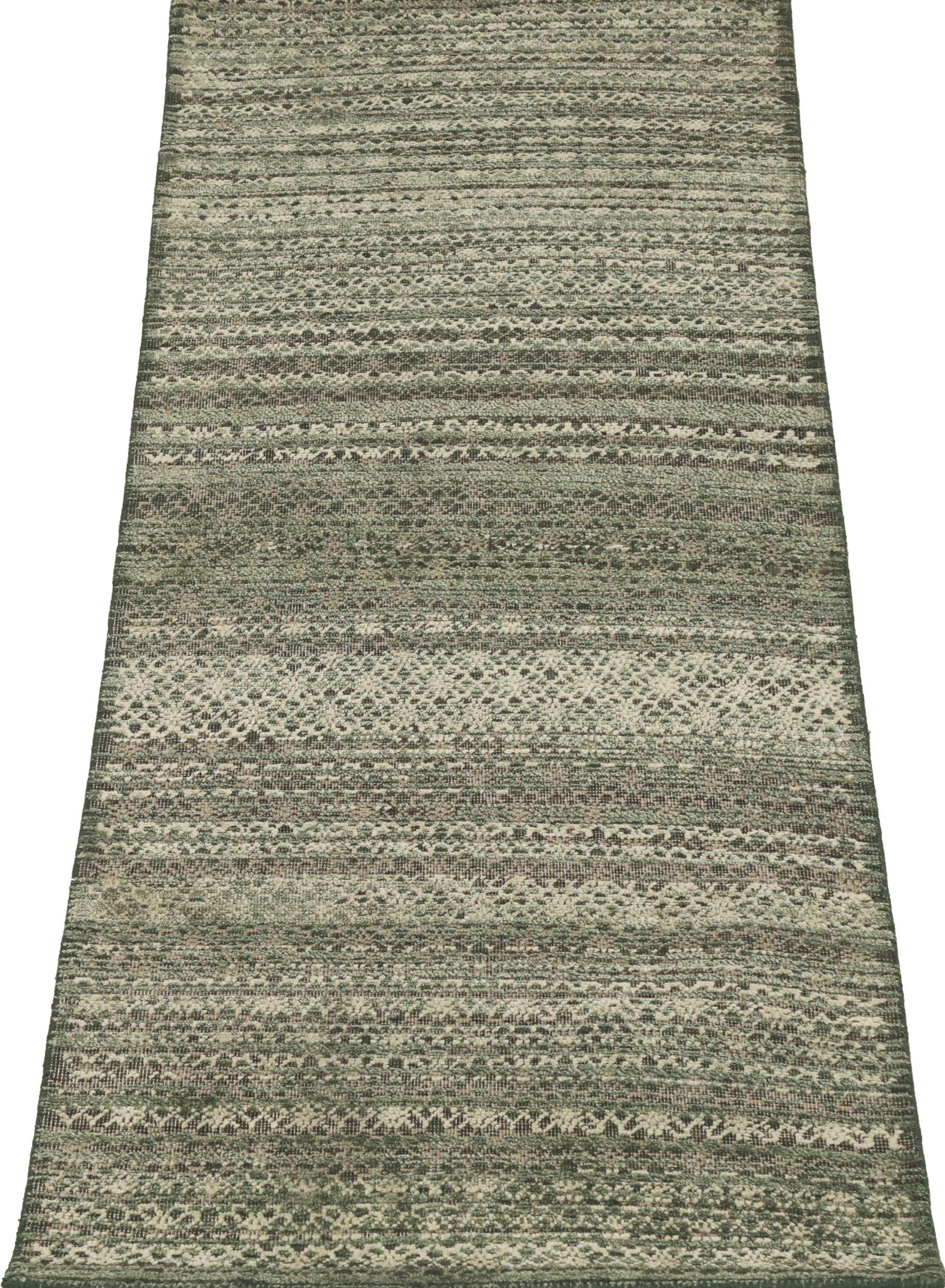 Contemporary Indian Geometric Small Rug: A Textured Tapestry of Greens and Cream

A Field of Subtle Pattern and Modern Simplicity
This captivating Indian small rug immediately draws the eye. Its expansive field features a striking geometric design