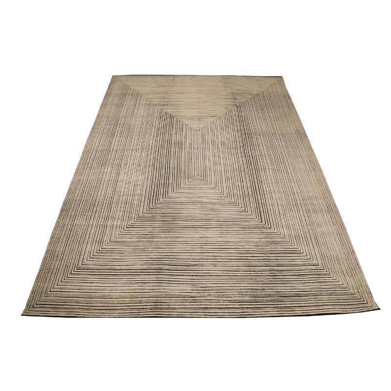 A Modern Indian Wool Area Rug with Moroccan Design Influence

This rug creates a striking visual statement, with its bold lines and minimalist palette. It offers a contemporary foundation that draws the eye and defines any modern space.

Visual