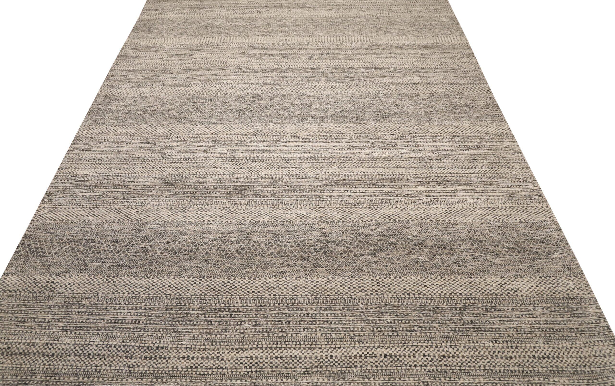 Modern Moroccan-Inspired Wool Area Rug

This extraordinary rug manifests minimalist sophistication and intricate textural artistry. Its refined tonal palette and structured horizontal patterns create an unyielding foundation of elegant calm and