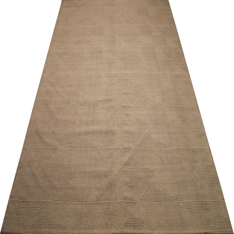 The Art of Quiet Luxury: A Minimalist Textural Wool Rug
This magnificent oversized area rug is a masterpiece of quiet luxury, a textile that celebrates the profound beauty of texture and minimalist form. It draws inspiration from the elemental