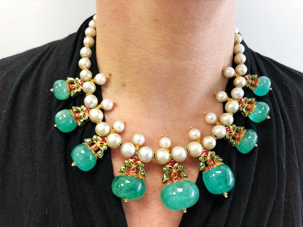India Motif Emerald Pearl Diamond Reversible Suite in 22k Yellow Gold.
An elaborate suite attributed to Indian adornments fashioned in the 1980s, this suite includes an elaborate necklace with complimentary earrings. A hand-fabricated belcher chain