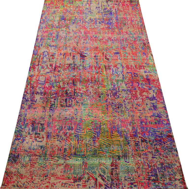 Allow this extraordinary modern/contemporary wool area rug to transform your space into a celebration of joyful energy and artistic expression. Measuring an impressive 9 feet by 12 feet 1 inch (108 inches x 145 inches), this generously proportioned