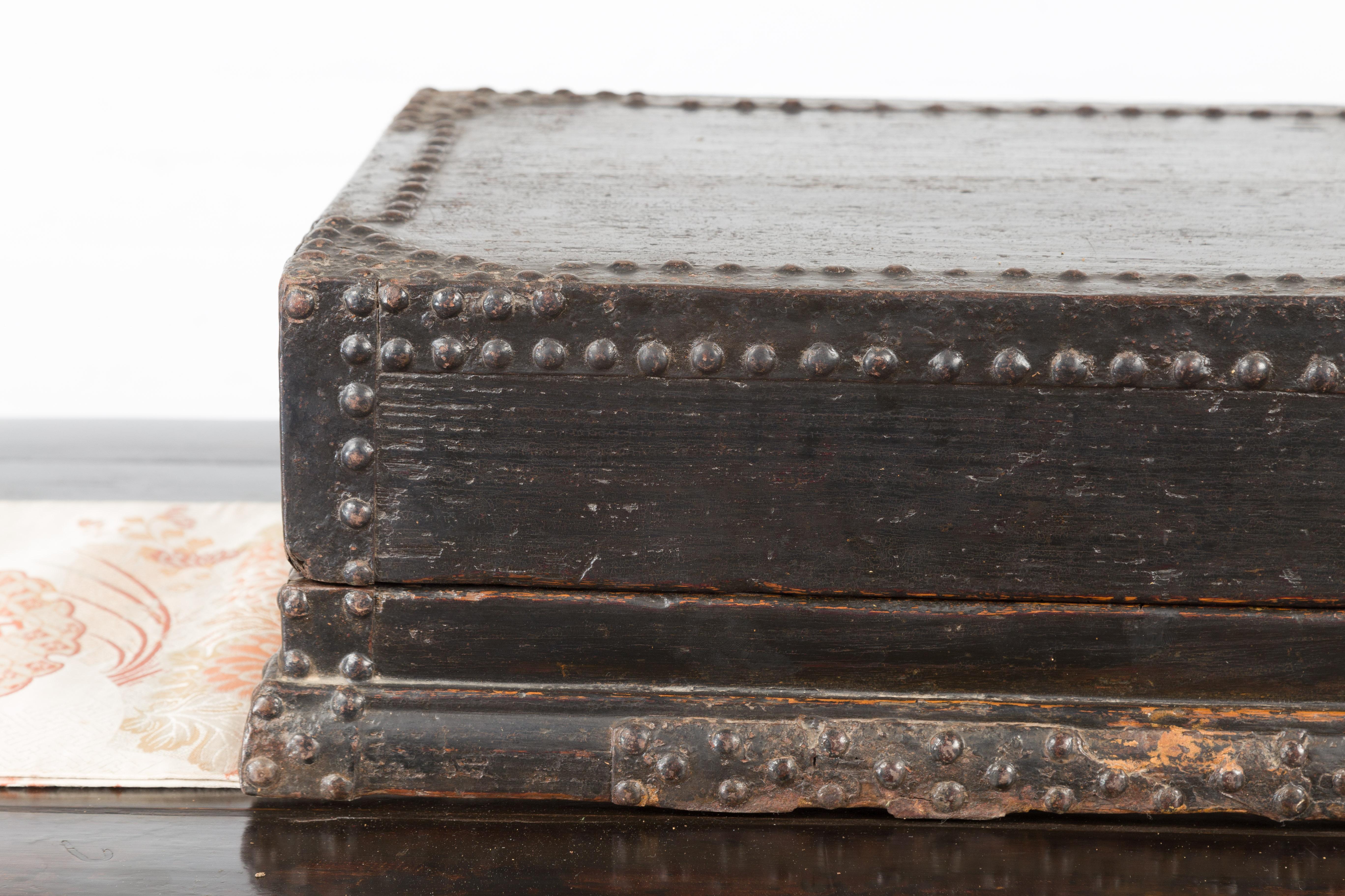 Indian 19th Century Black Box with Iron Nailheads, Braces and Rustic Patina For Sale 1