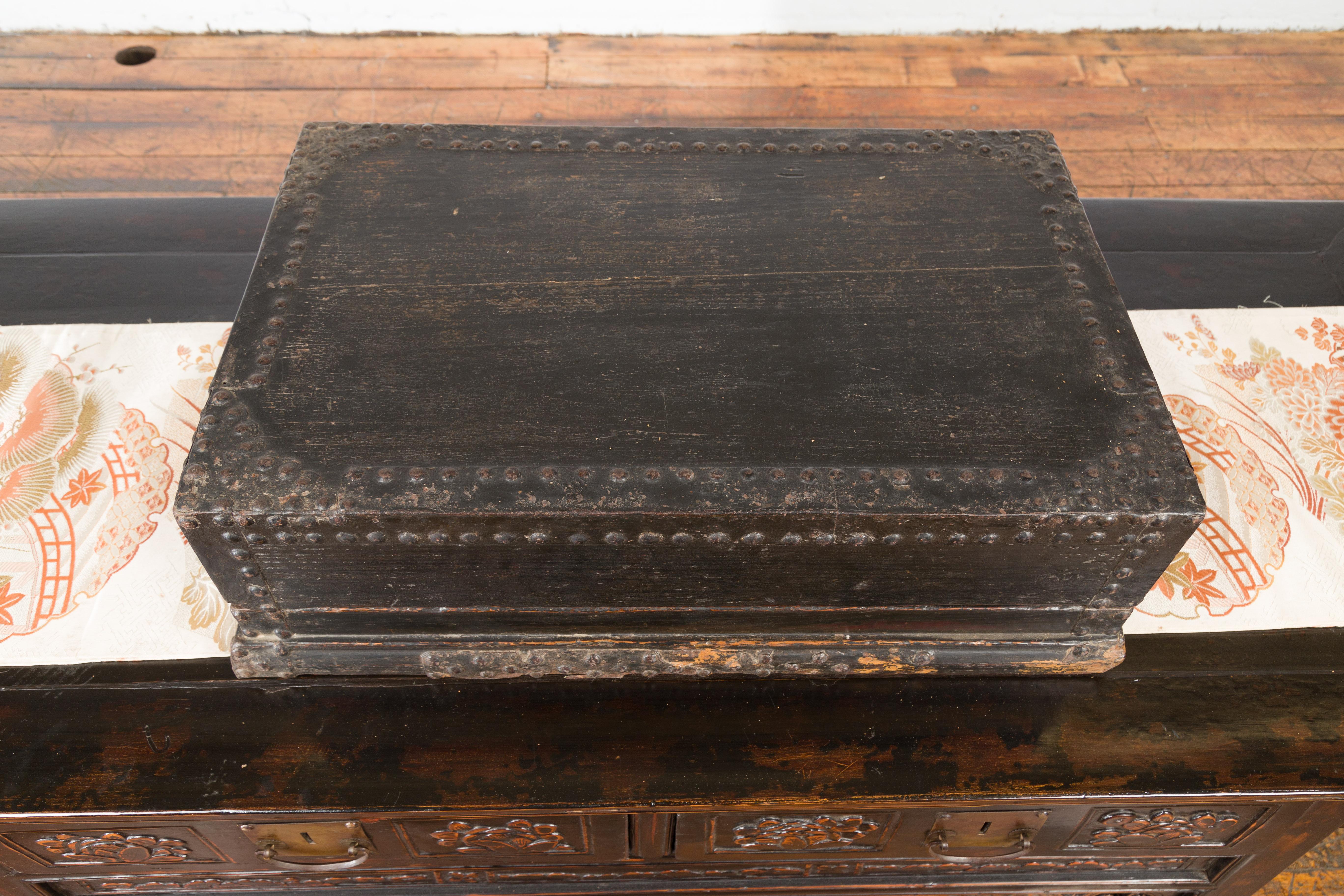 Indian 19th Century Black Box with Iron Nailheads, Braces and Rustic Patina For Sale 4