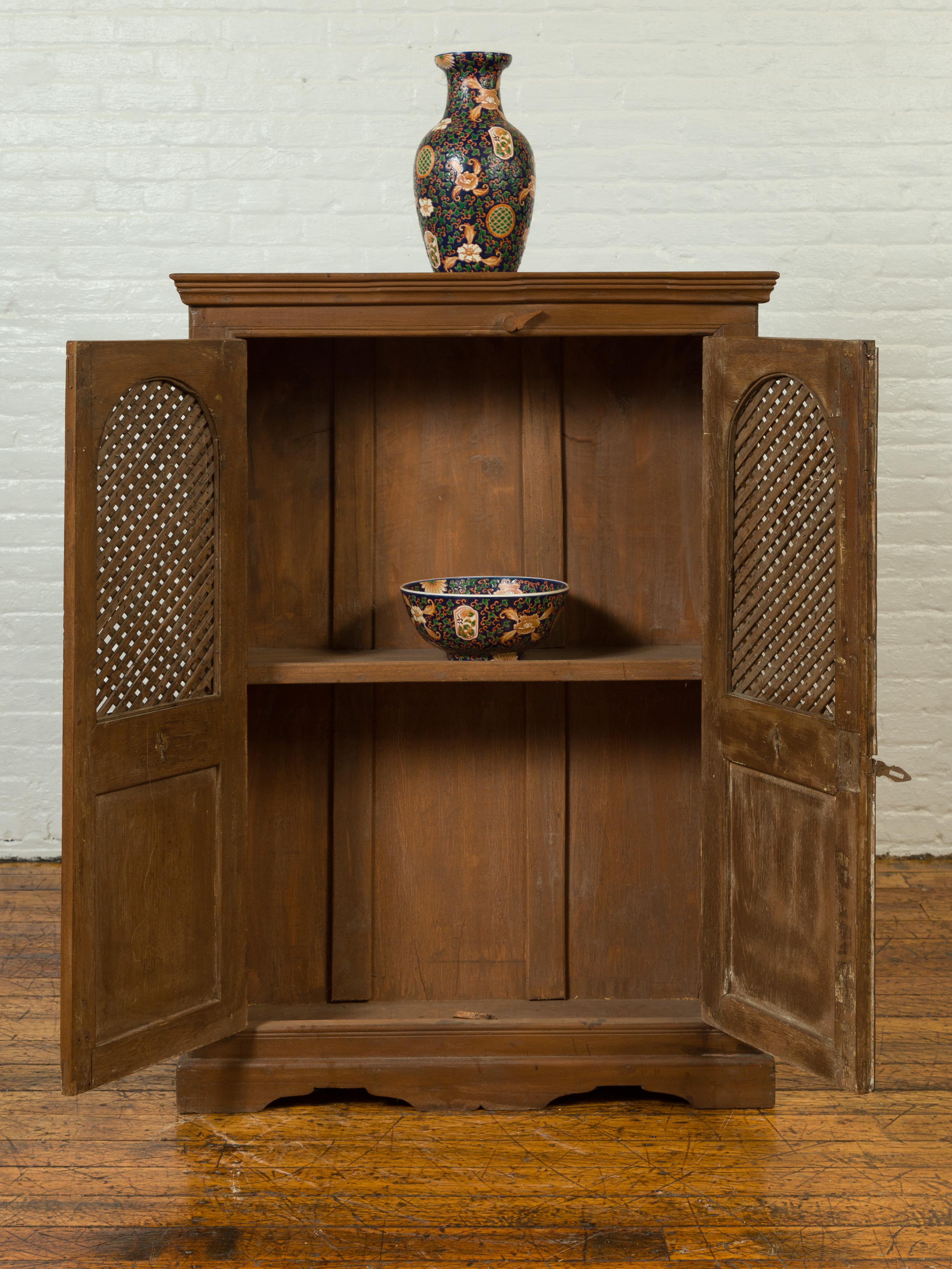 Indian 19th Century Cabinet with Metal Fretwork Motifs and Oval Medallions In Good Condition For Sale In Yonkers, NY