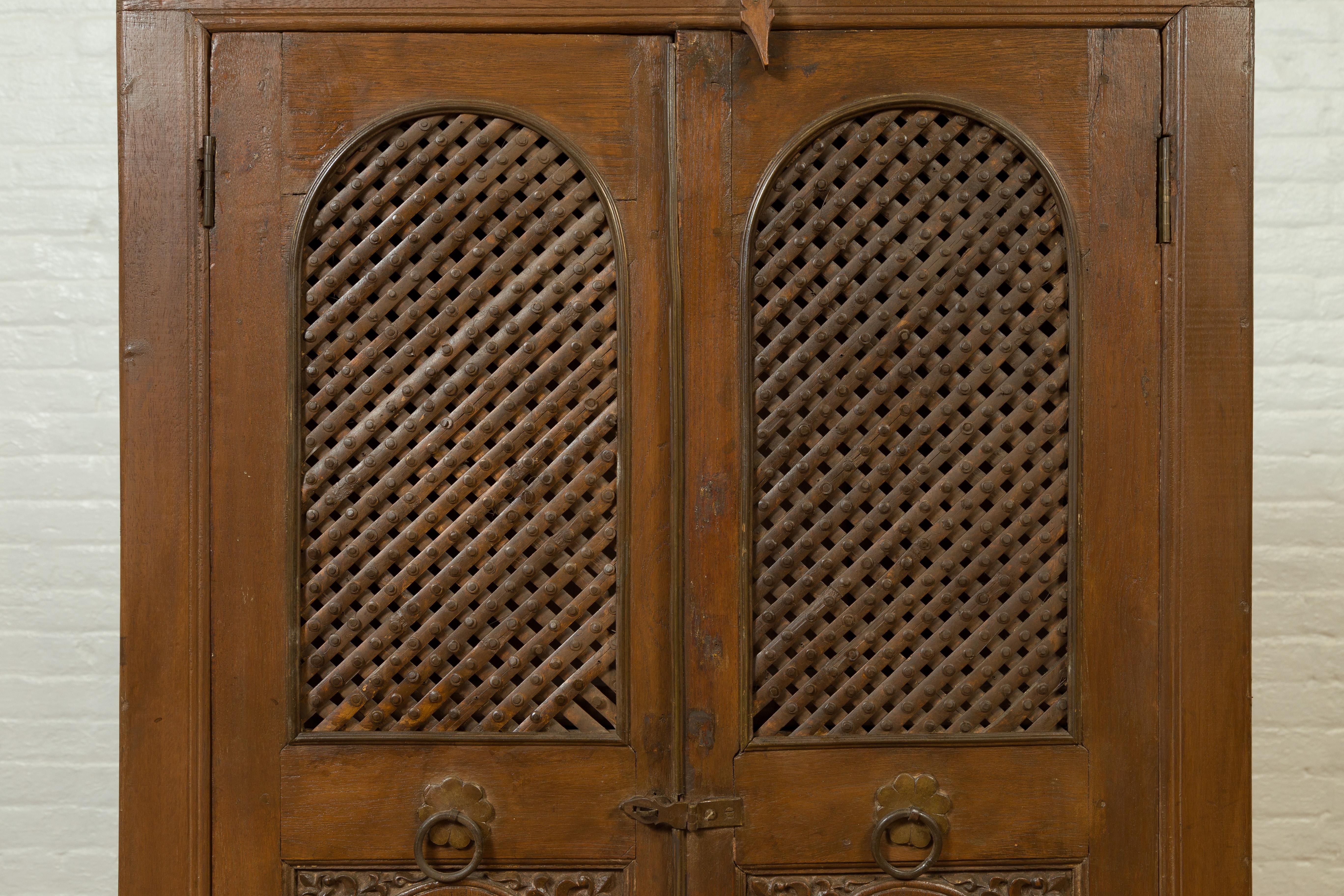 Wood Indian 19th Century Cabinet with Metal Fretwork Motifs and Oval Medallions For Sale