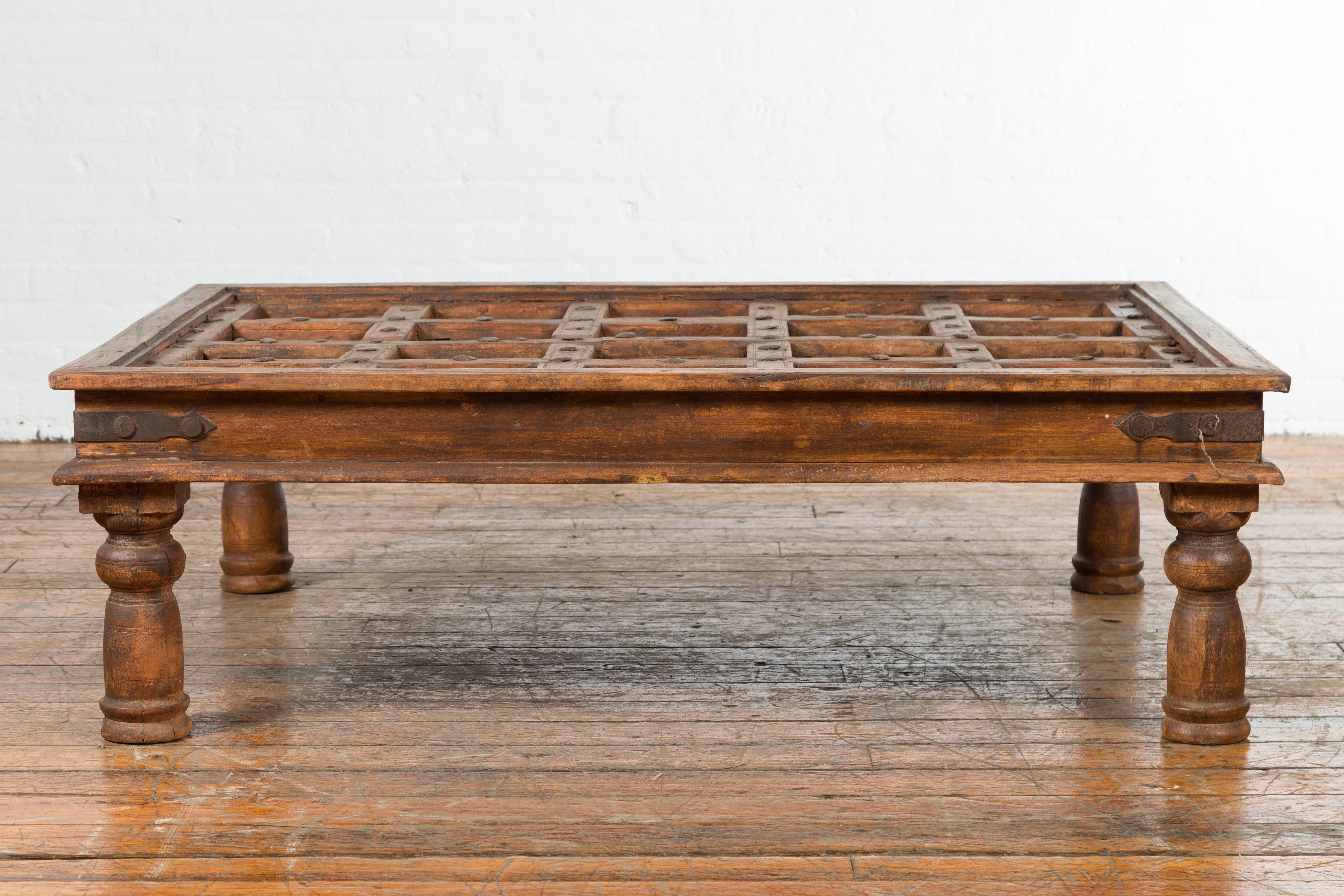 Indian 19th Century Paneled Door with Iron Accents Turned into a Coffee Table 6