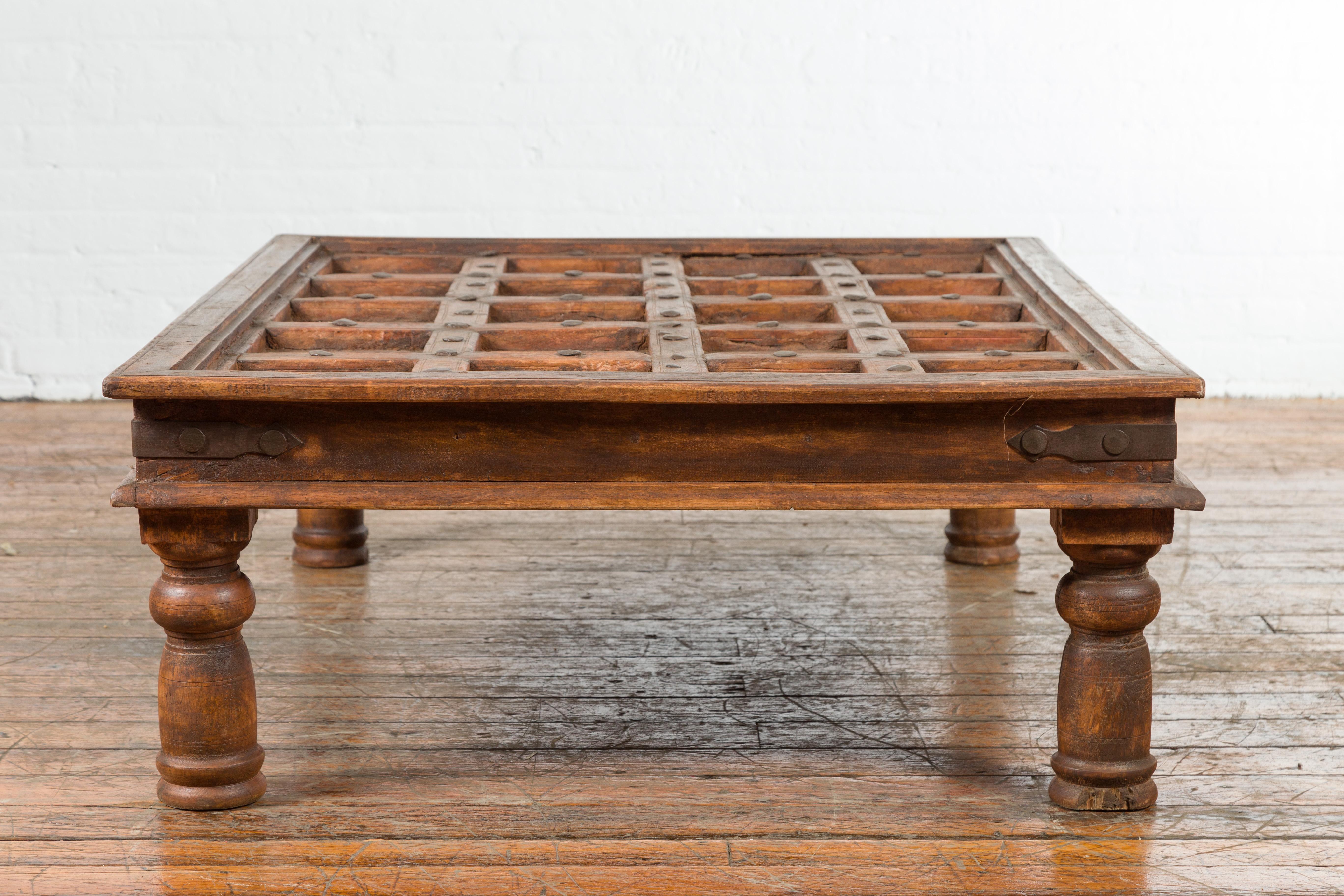 Indian 19th Century Paneled Door with Iron Accents Turned into a Coffee Table 7