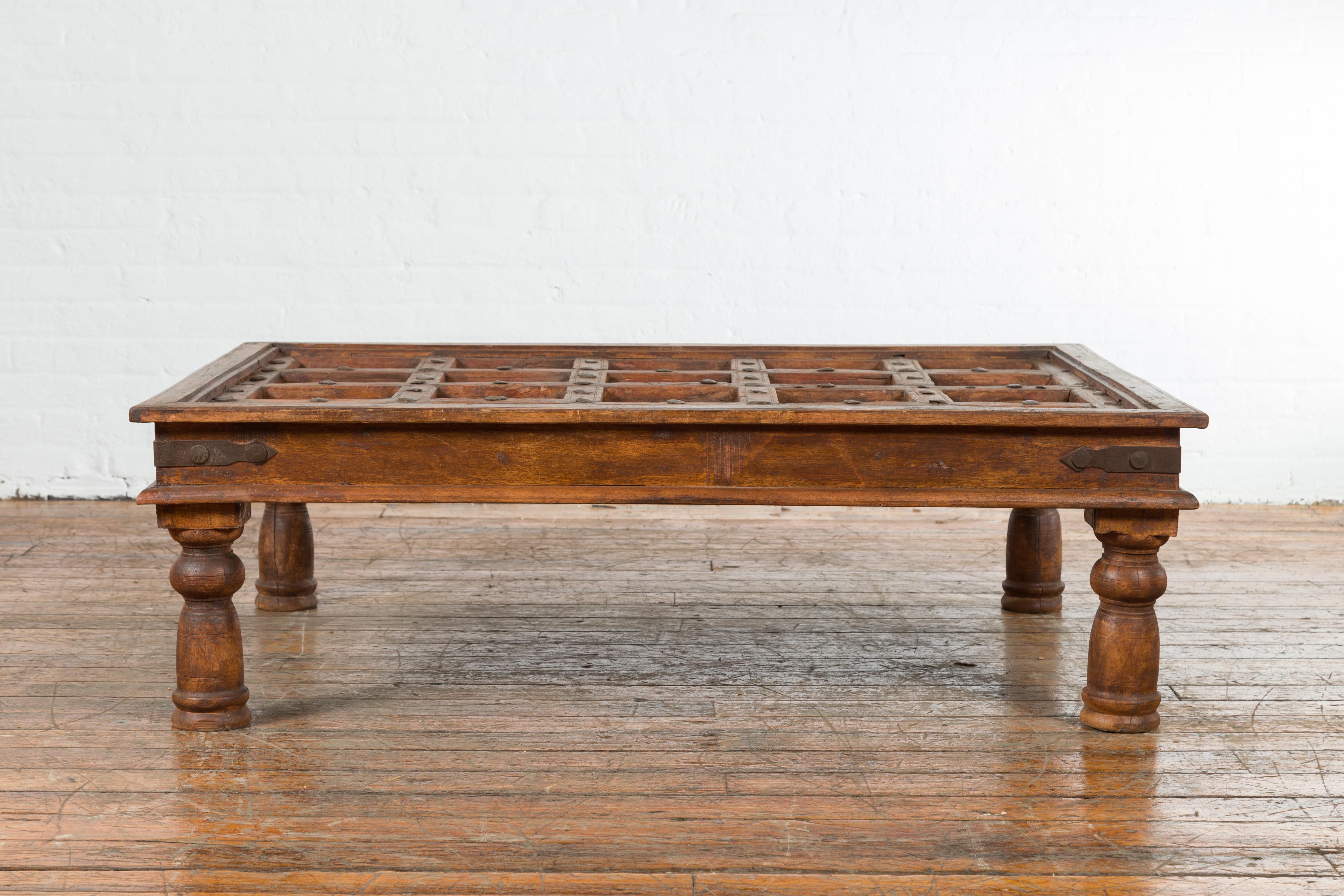 Wood Indian 19th Century Paneled Door with Iron Accents Turned into a Coffee Table
